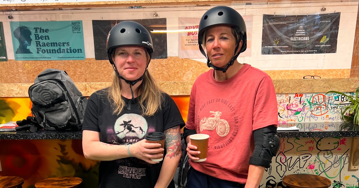 A girl riding a scooter at The Skate Farm indoor skatepark in Sussex