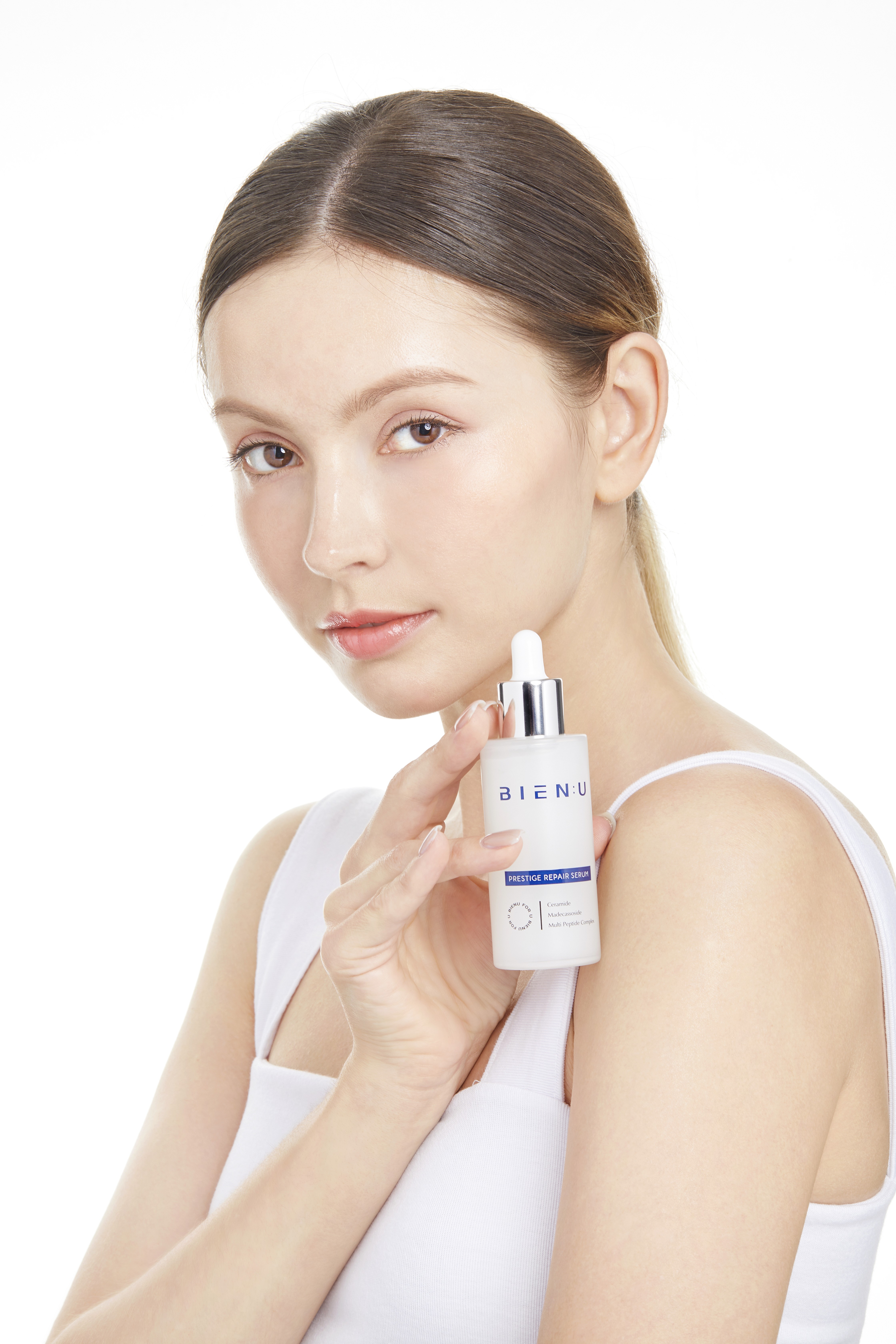 Wide shot of a minimalist Scandinavian living room with a large sofa, a coffee table, and natural light, illustrating timeless design.