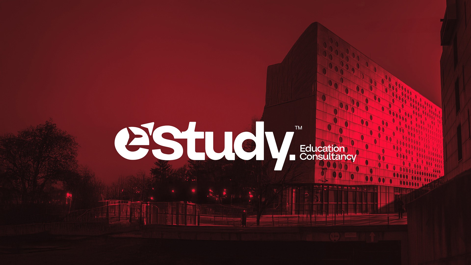 Estudy Education Consultants brand identity featuring logo on a red-lit campus building at night
