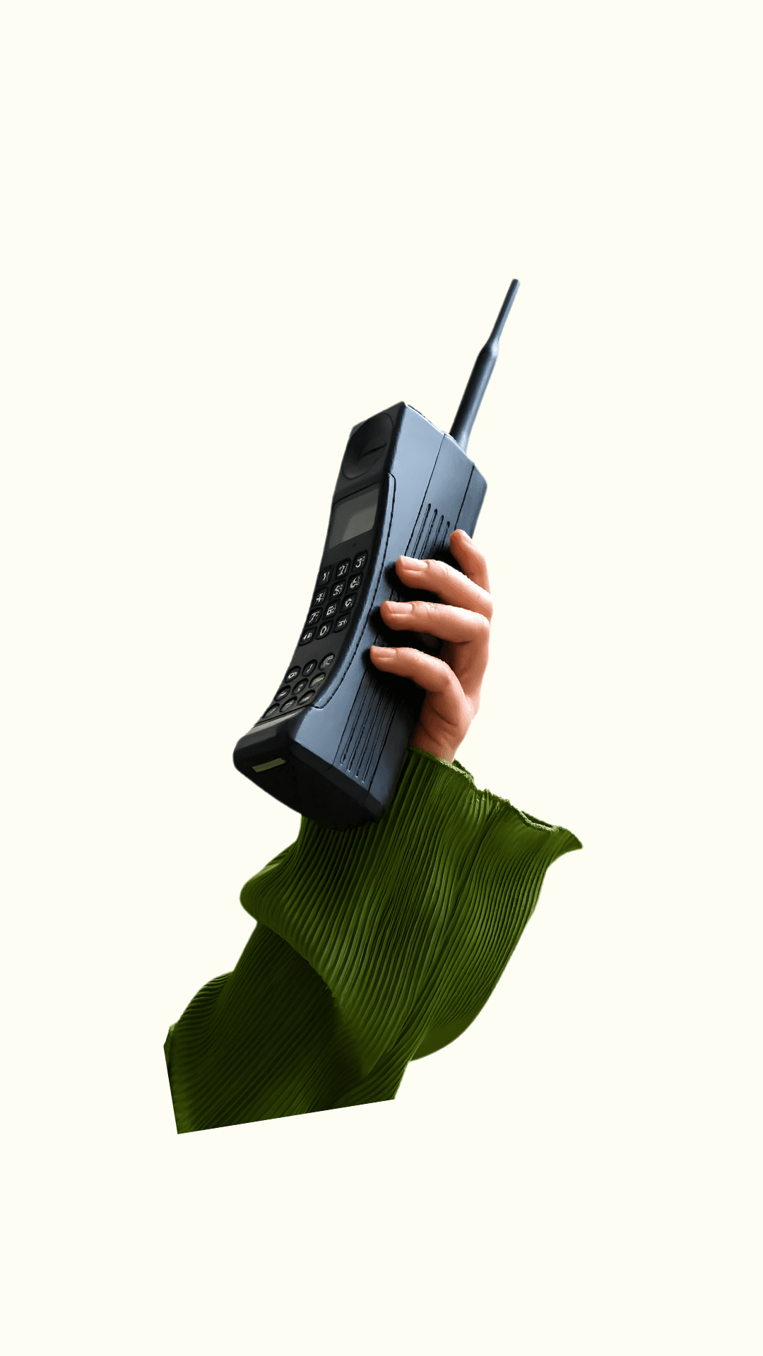 Hand holding a large vintage brick mobile phone against a dark background