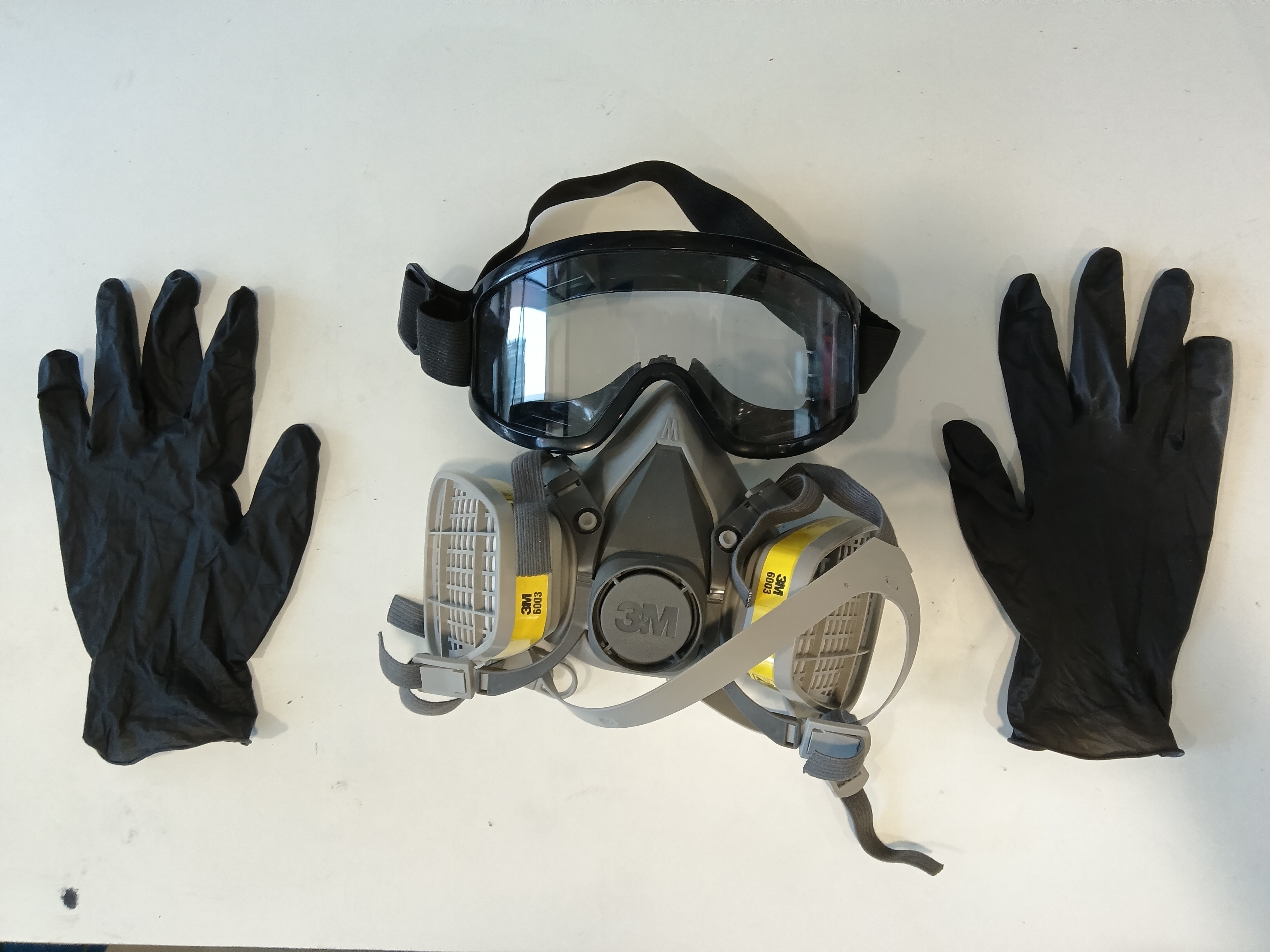 brown wooden lounger near body of water