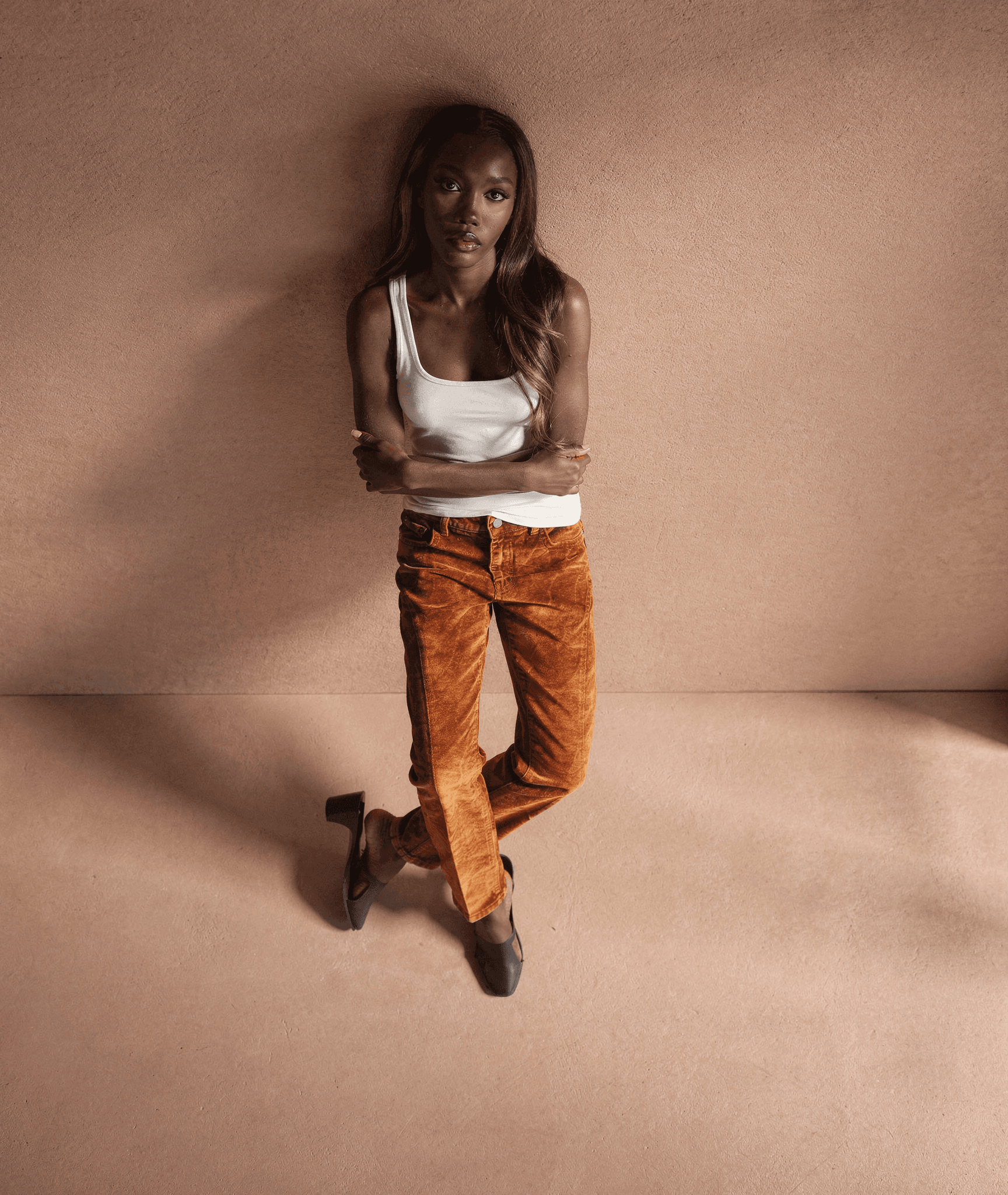 grayscale photography of woman wearing long-sleeved shirt