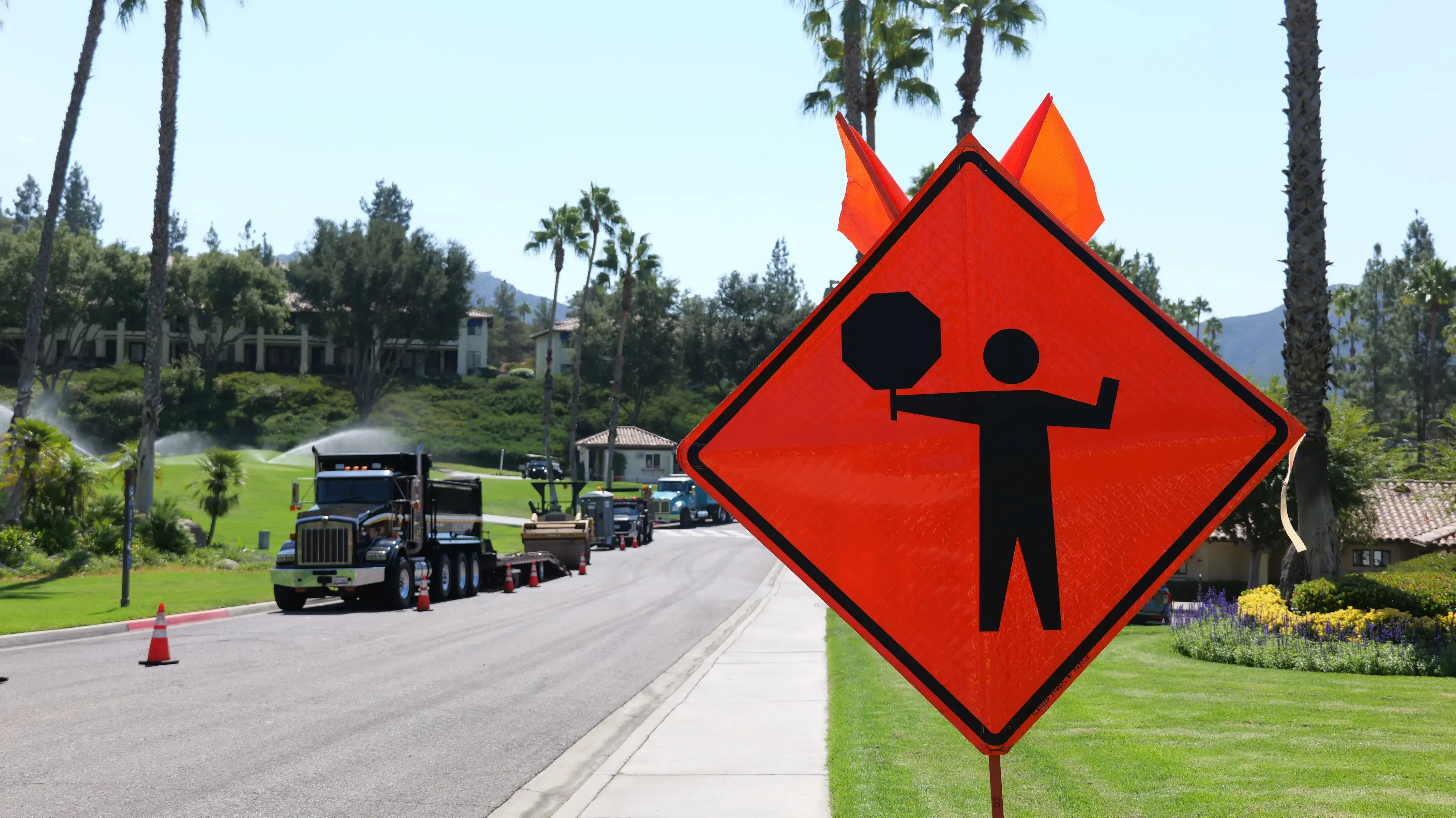 Traffic control road work flagger sign