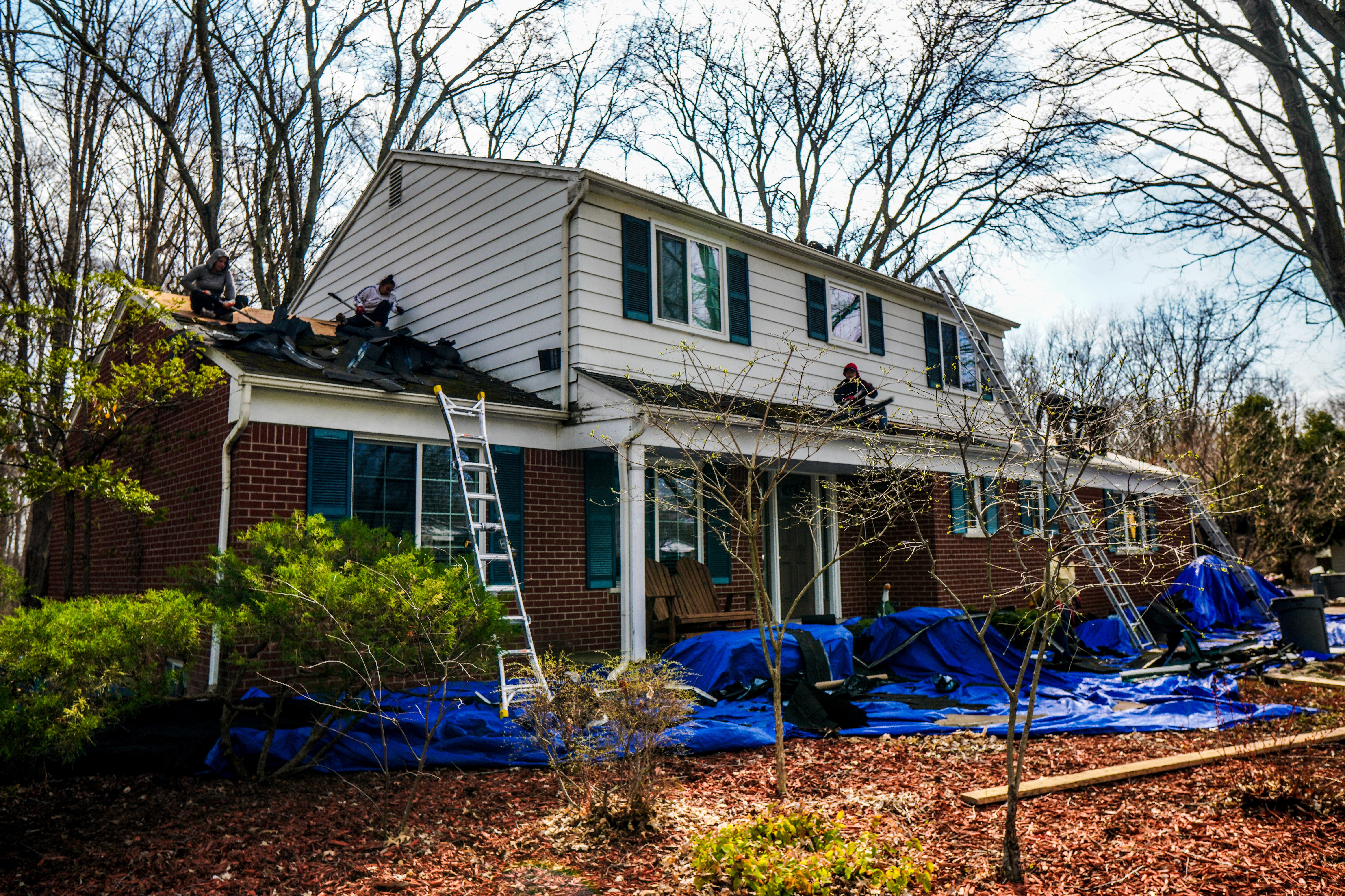 Two-story home during an exterior renovation