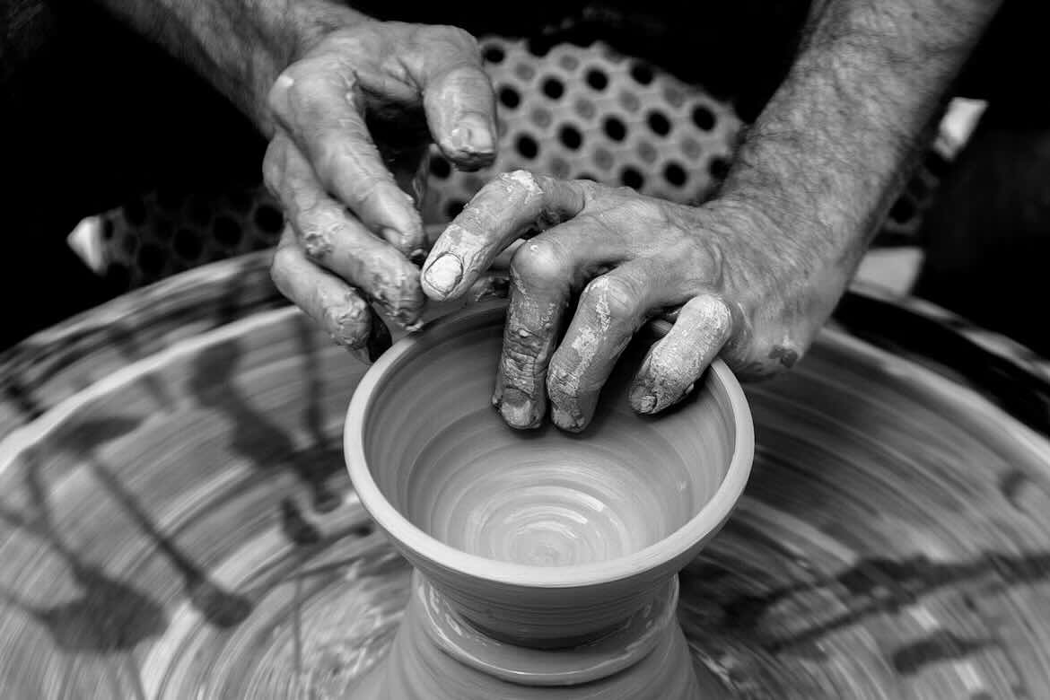 grey picture of Making pottery with both hands