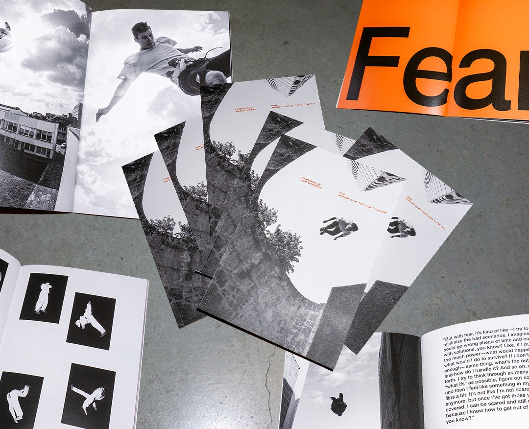 photobooks stacked on the floor