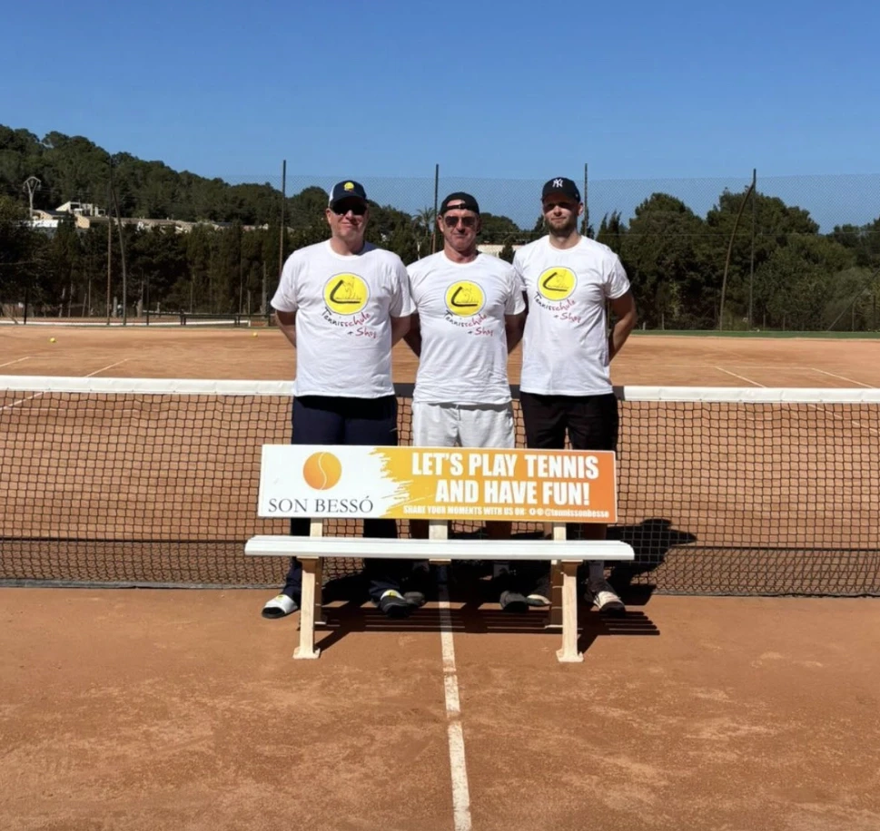 four men playing double tennis during daytime