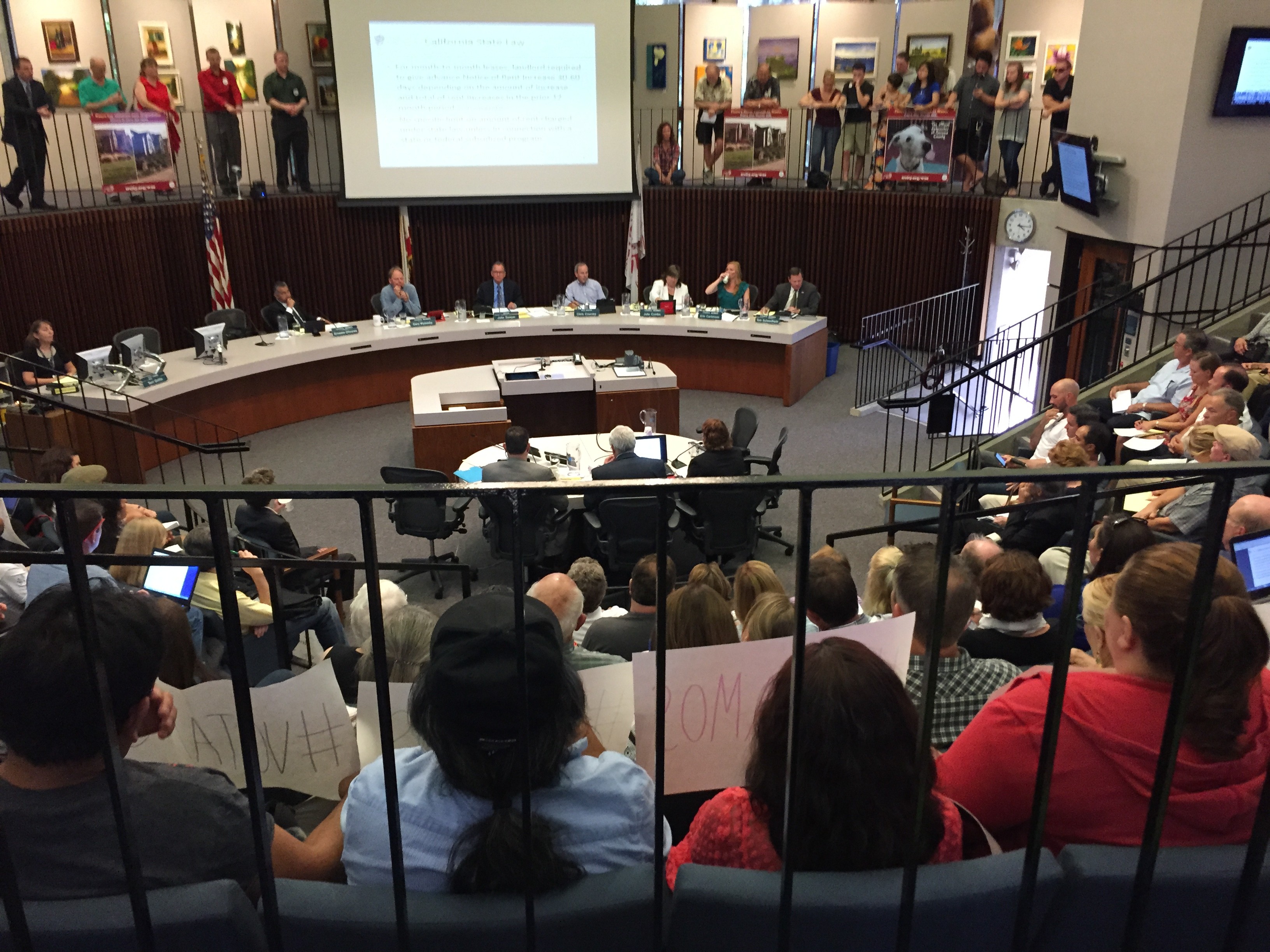 a group of children standing around each other