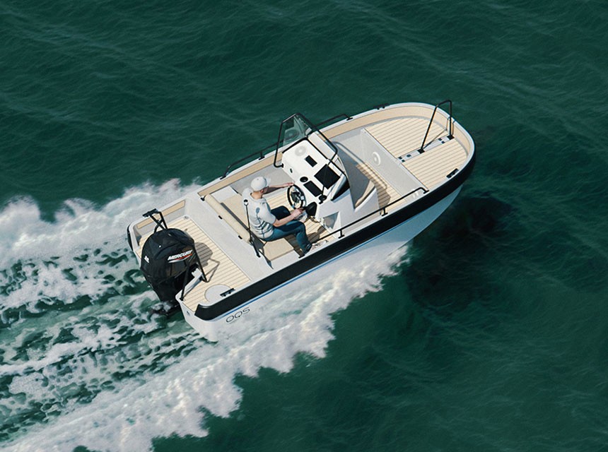 A tender caramaran OQS Tender Carbon moving fast in the sea