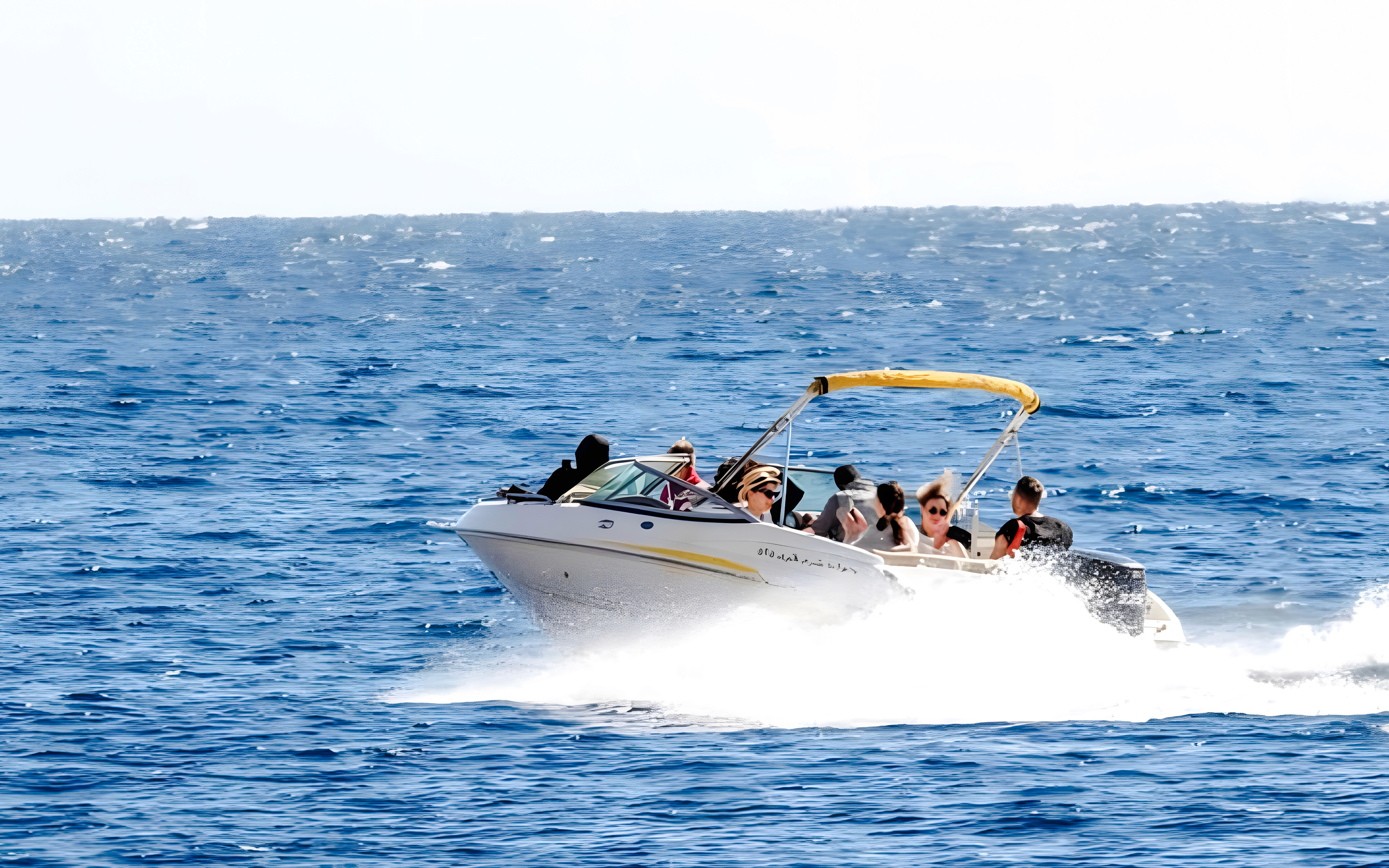 Tourists enjoying a private speedboat ride to Tiran Island.