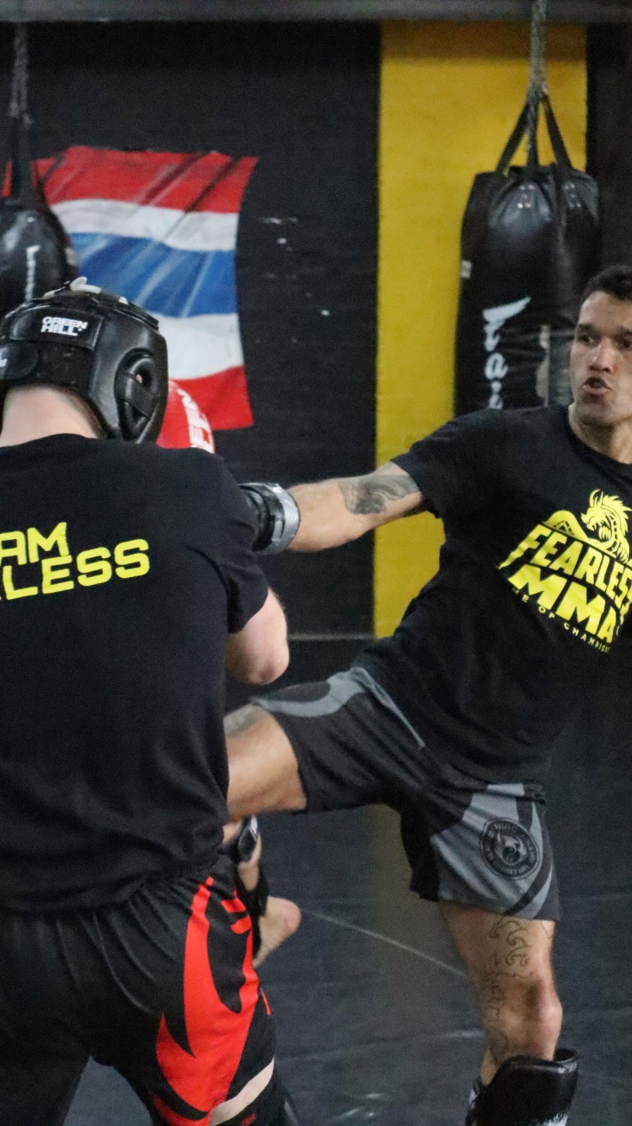 Striker on pads during a K-1 class at Fearless MMA