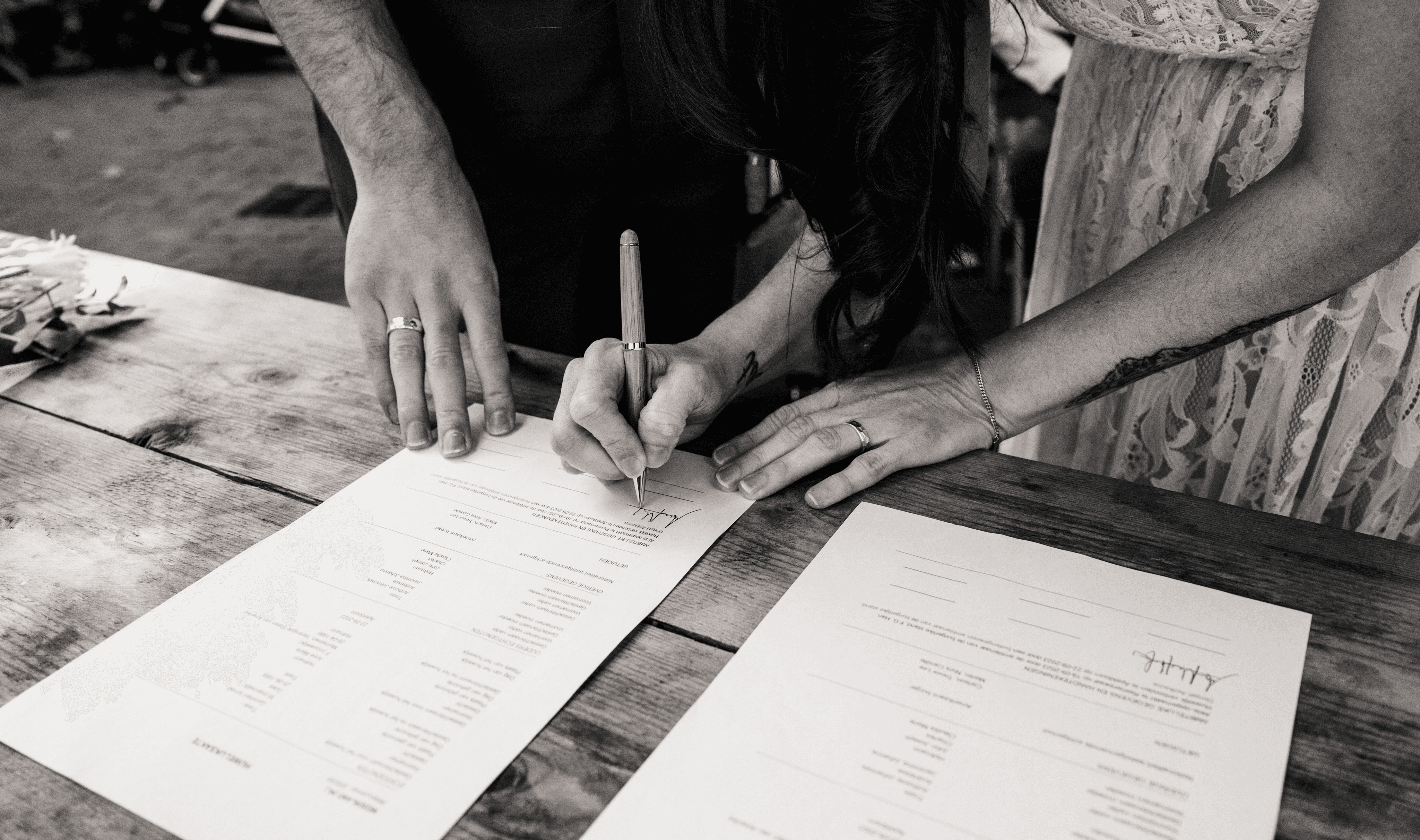 couple signing papers