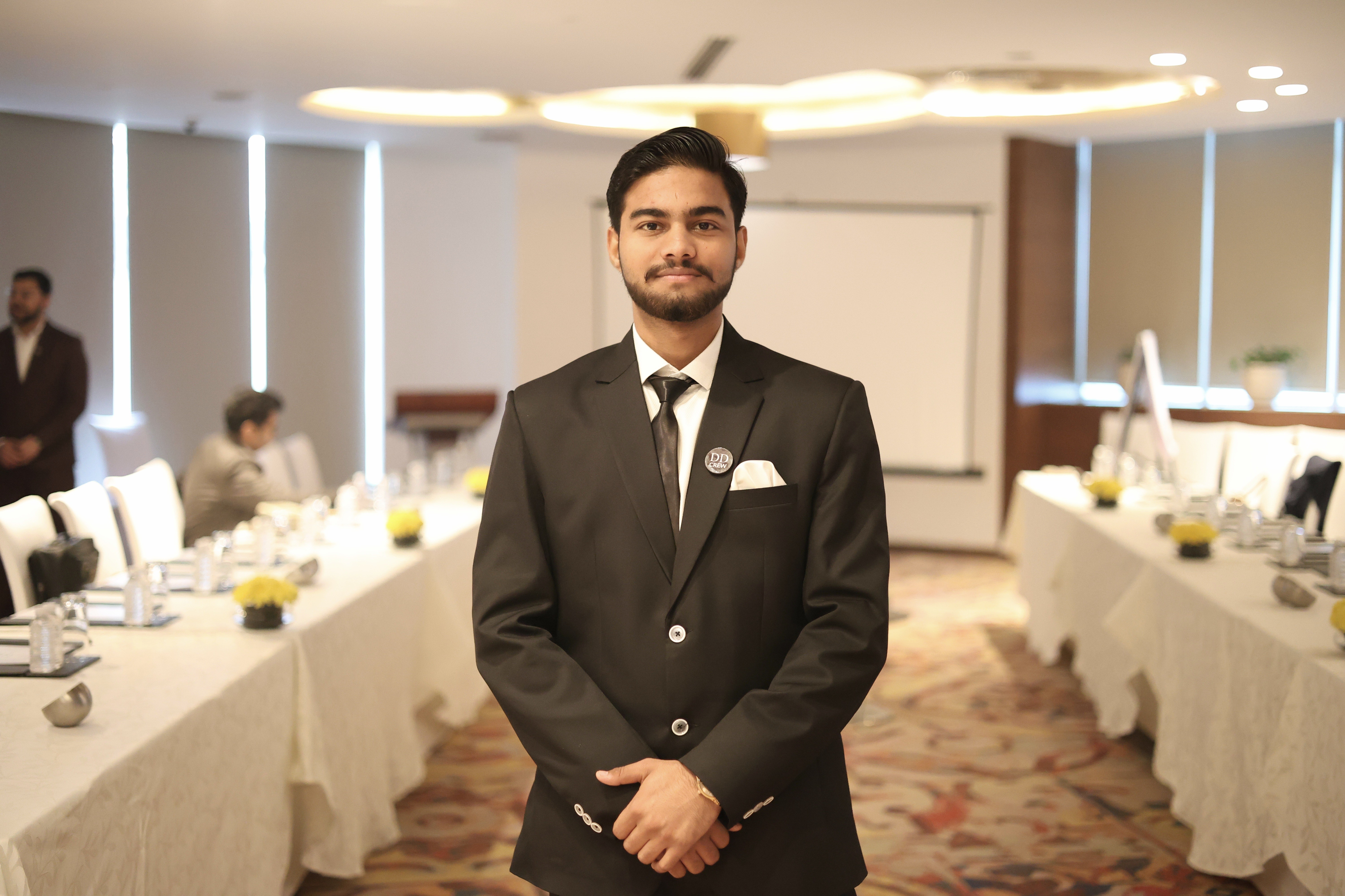 man wearing white V-neck shirt
