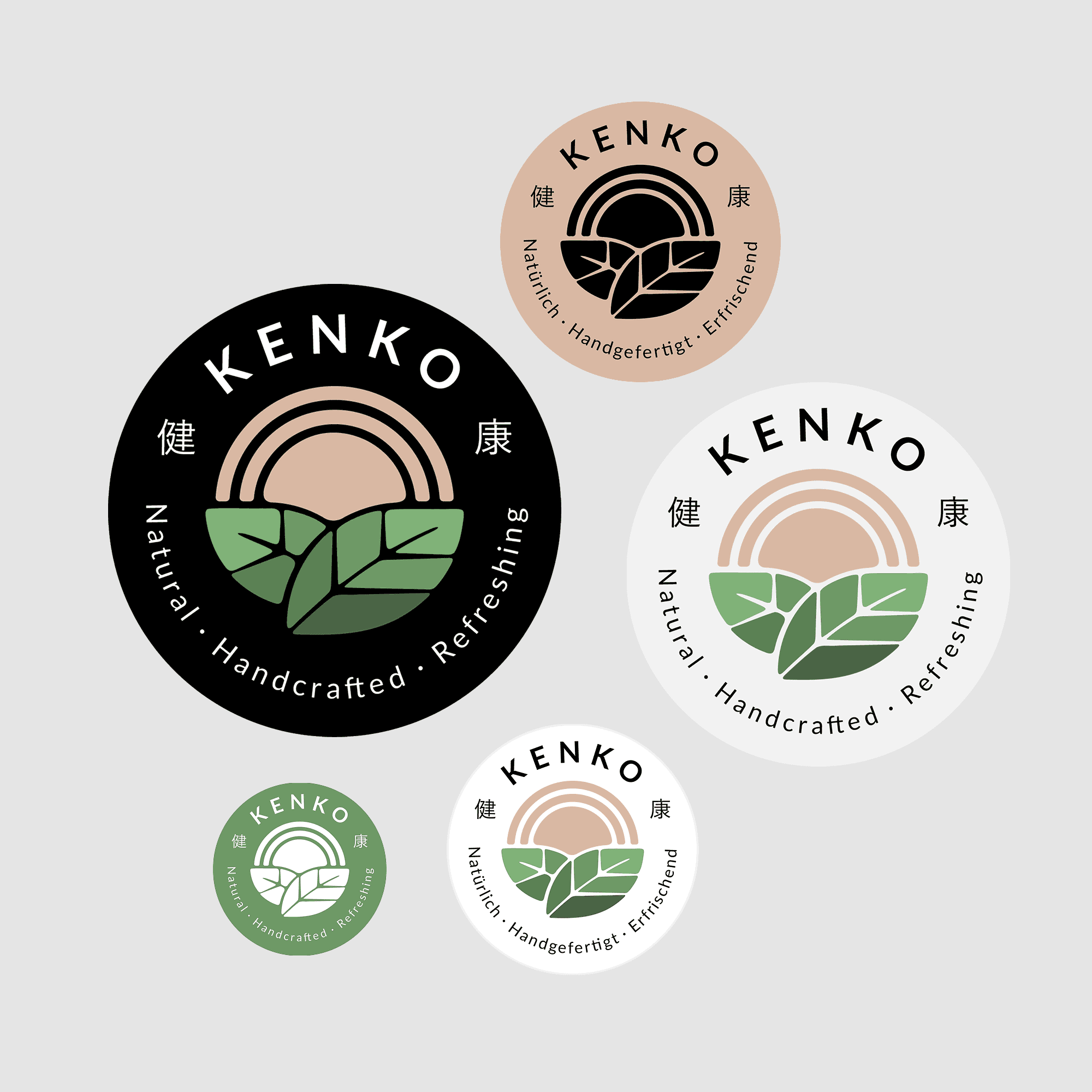 A collection of round sticker mockups showcasing different variations of the Kenkō logo design.
