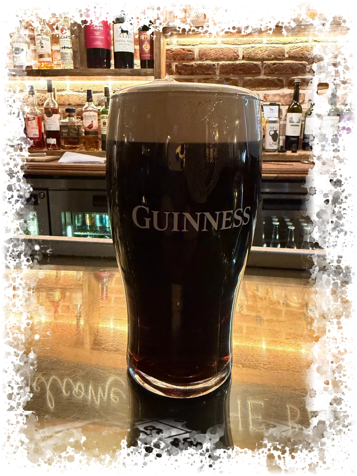 A pint of Guinness at the bar