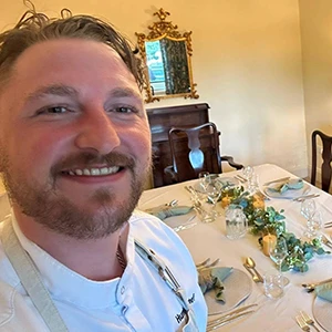 Coach tour chef, James Farrell the humble chef, working in the kitchen of his restaurant, headshot.
