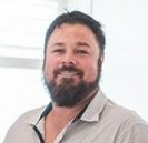 man standing in front of window