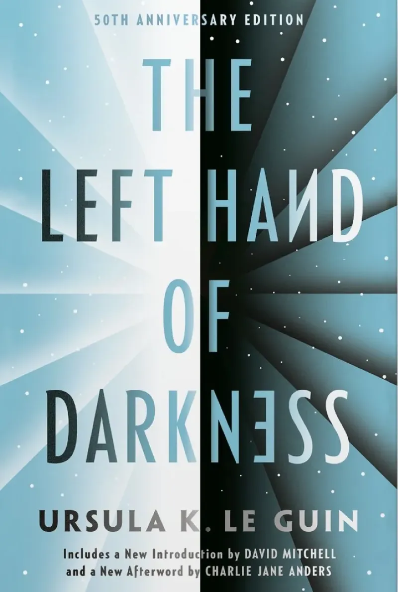 50th-anniversary edition cover of Ursula K. Le Guin's "The Left Hand of Darkness," featuring a symmetrical design with light and dark contrasting sides, text in white and black, and a starry background.