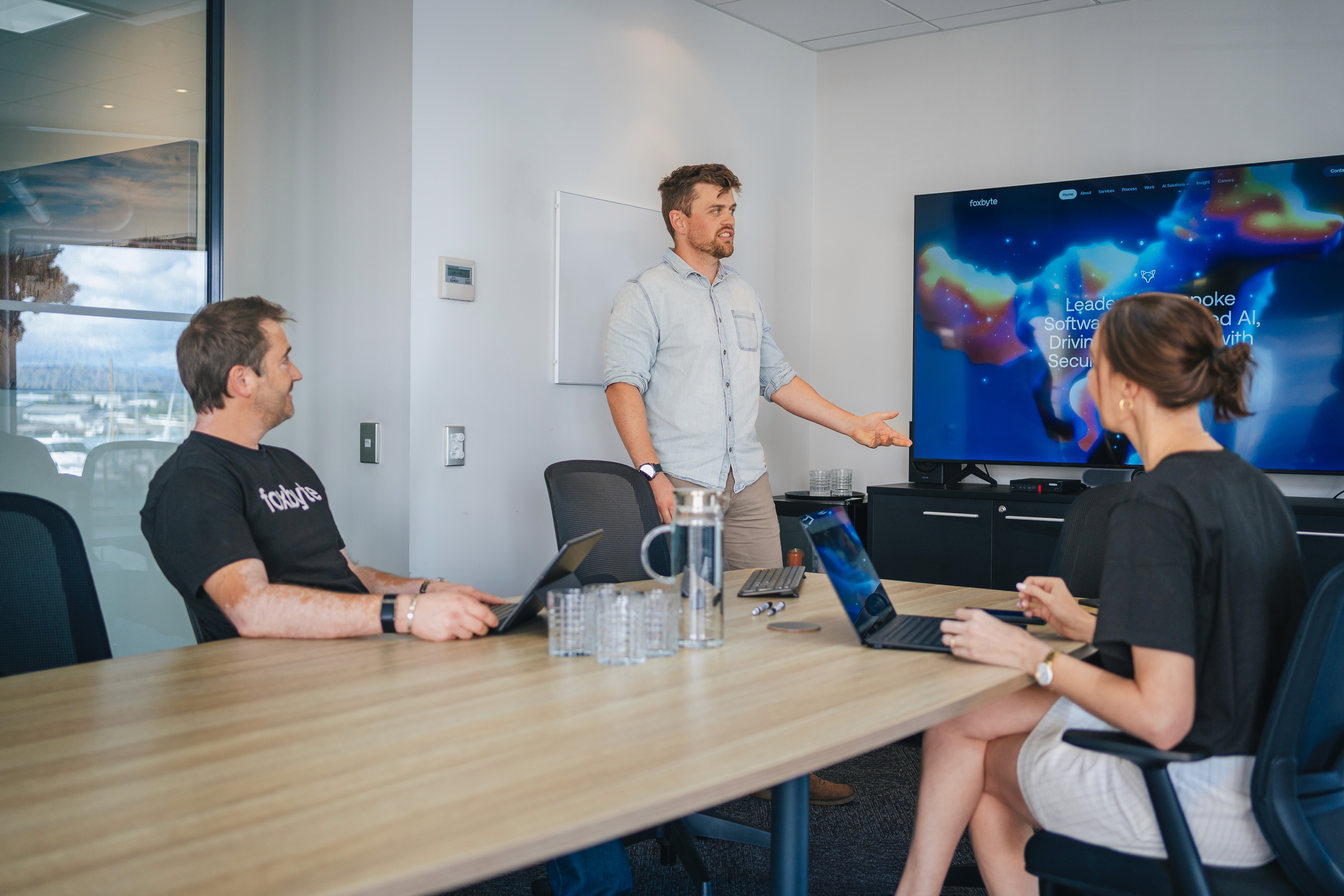 Webfox team members collaborating during a meeting in their Napier office – discussing AI and digital strategy.