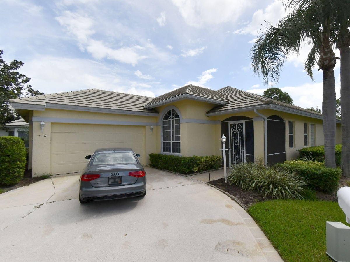 1994 New Roof Construction in Hawks View, PGA Village, Port St Lucie with Entegra Flat Broomswept Tile in Natural Gray