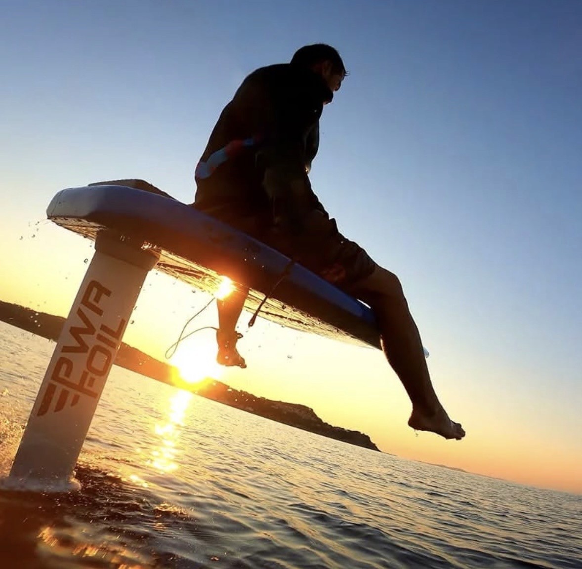 Group of men standing with Sufboard
