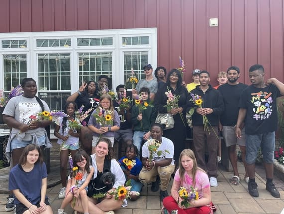 people in yellow jacket and black backpack
