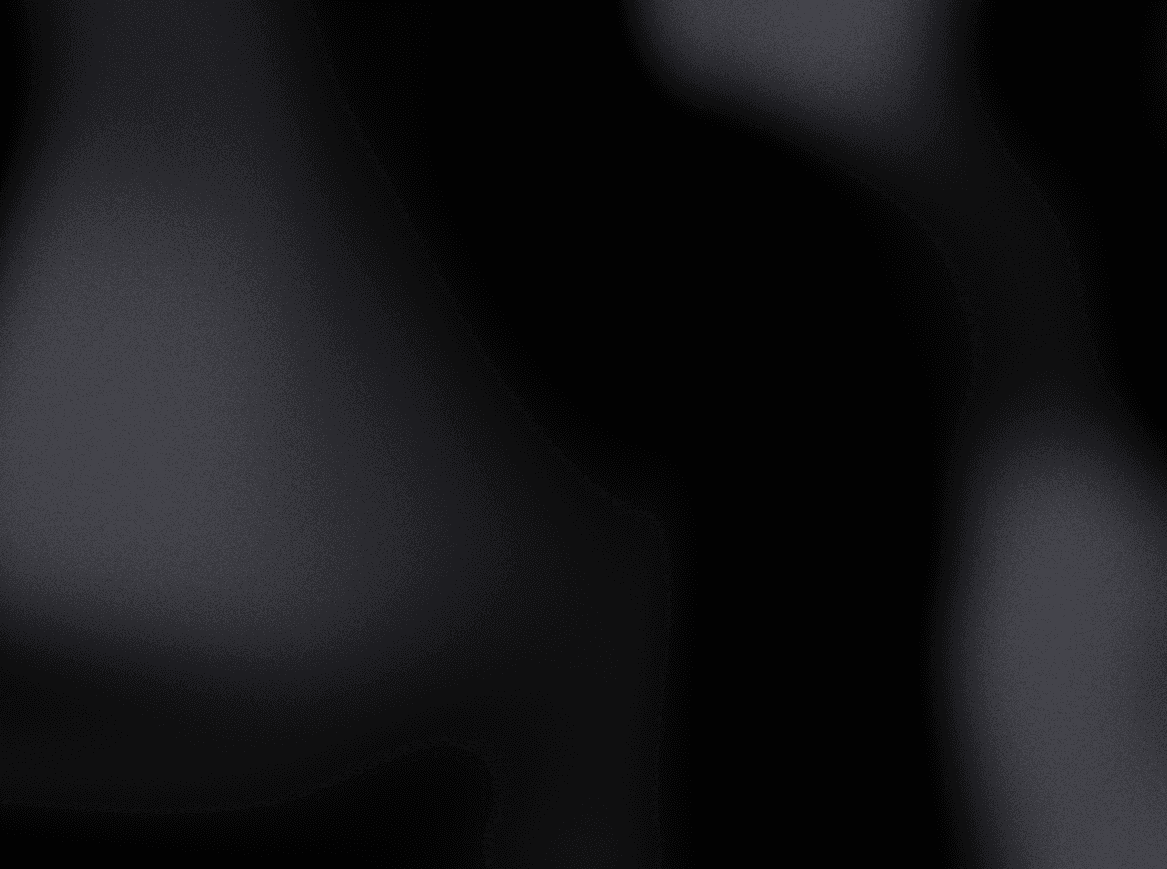 A gradient image transitioning from dark black to light gray tones.