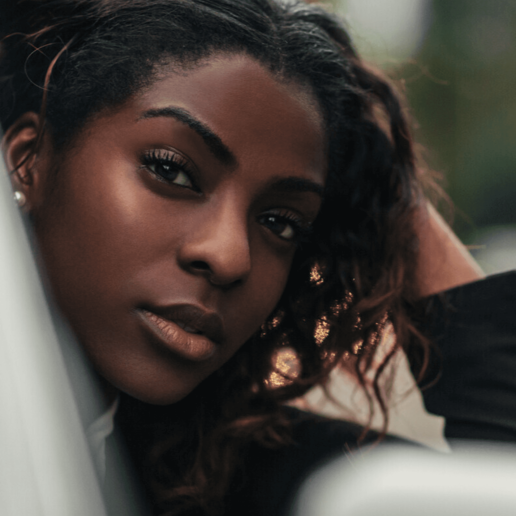 Woman looking out of a car window with its4women car insurance for over 30s