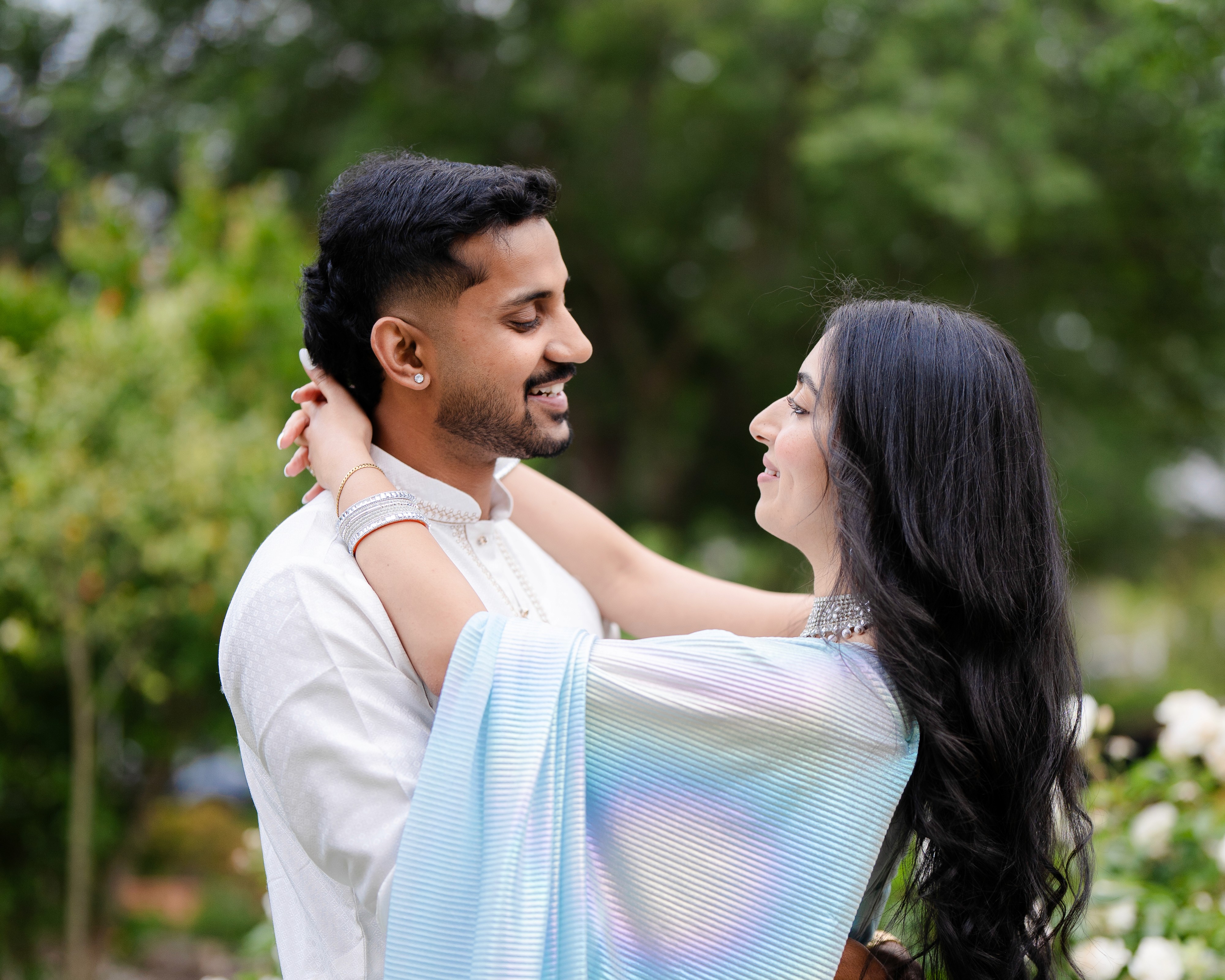 Person planting a houseplant and checking phone