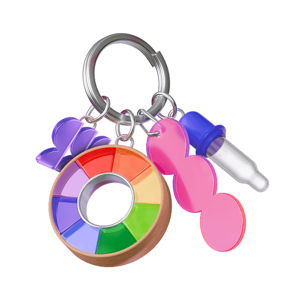 A colorful keychain with a rainbow color wheel, pink shapes, and a dropper bottle charm.