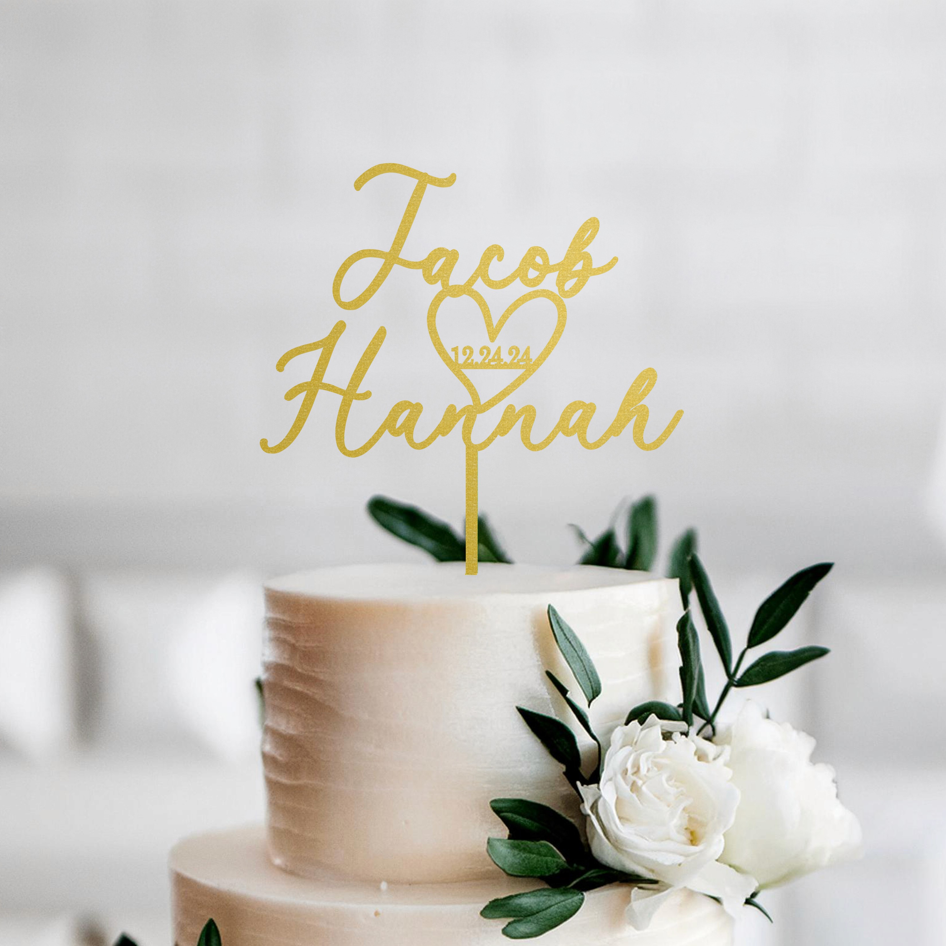 Personalized cake topper for weddings  with Jacob & Hannah names in Gold glitter, featuring a heart and wedding date. Perfect for adding a custom and elegant touch to your wedding cake. Handcrafted and available in multiple colors.