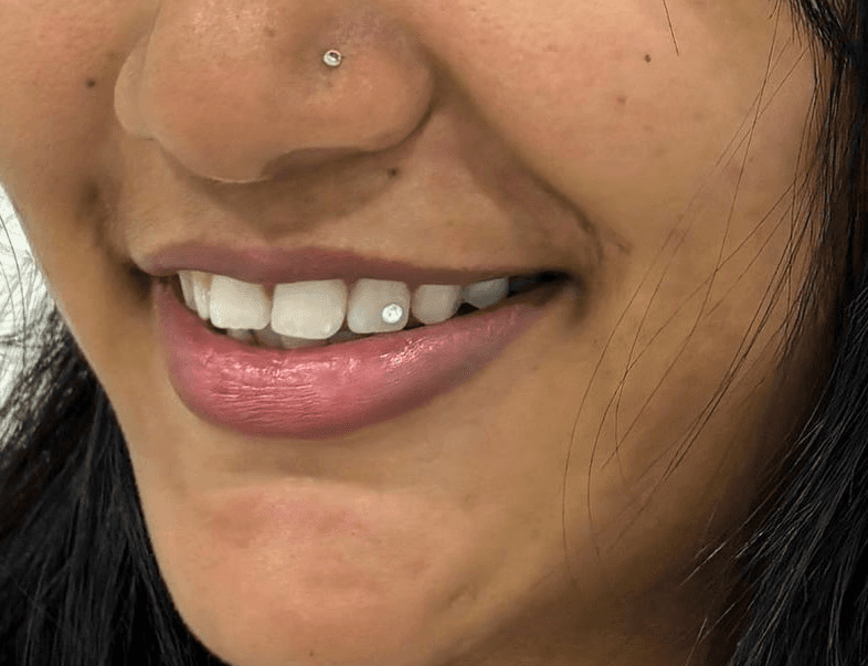 white candle on black textile