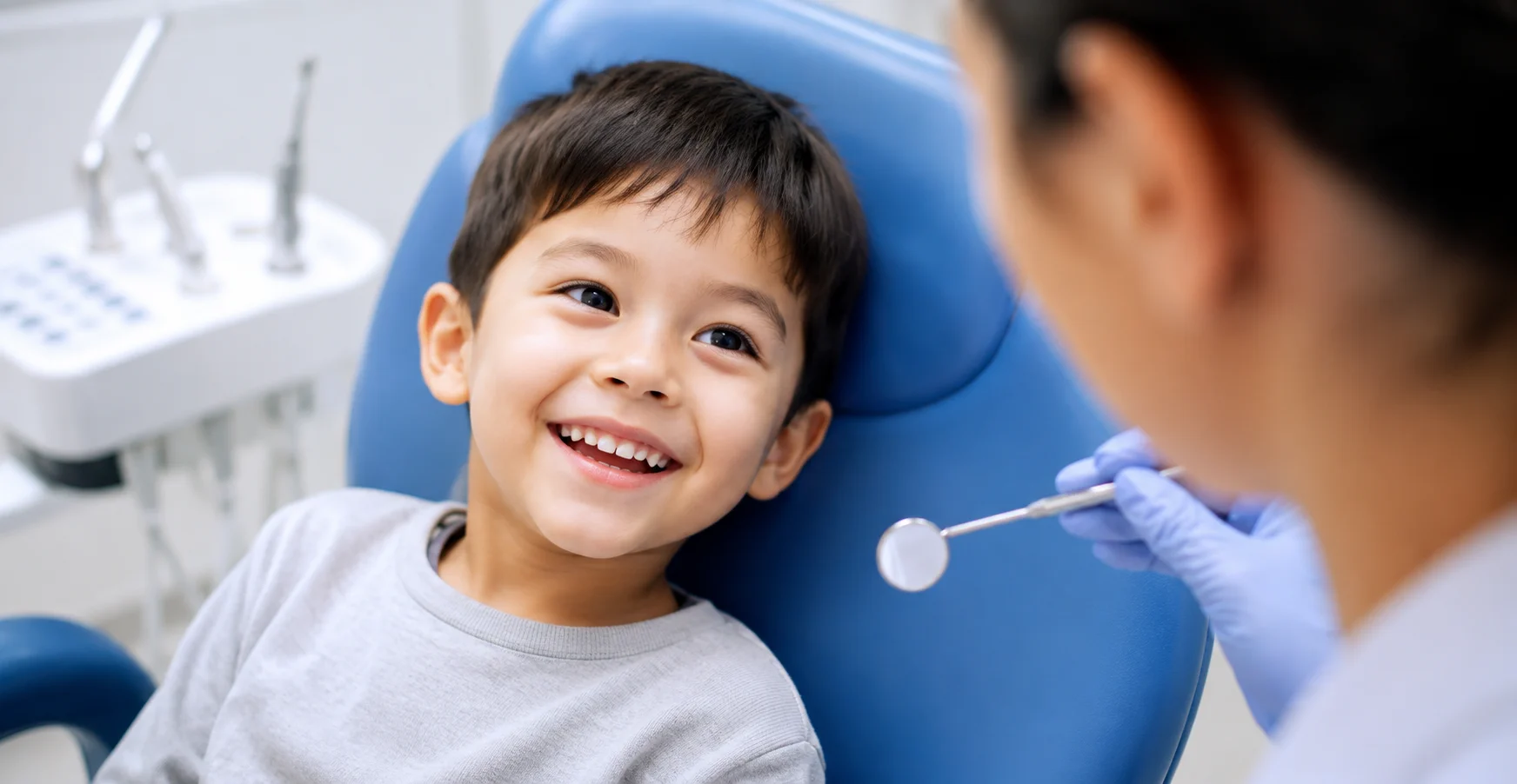 Smiling child patient during a gentle dental visit