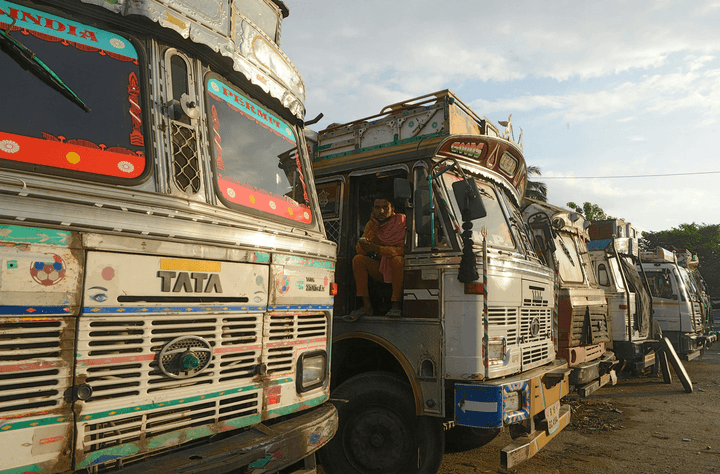 a man sitting in the drivers seat of a truck