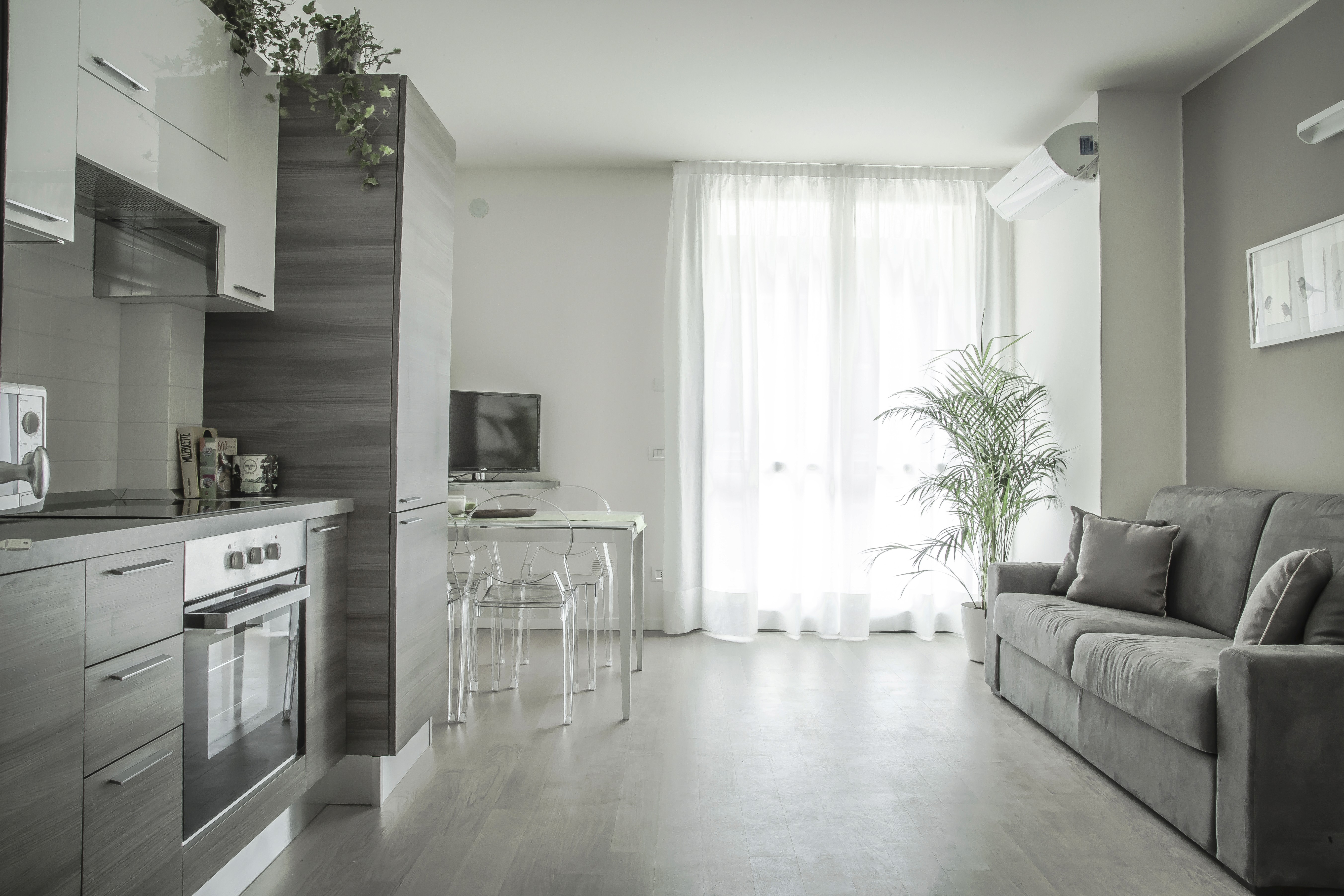 house interior with stairs and a tall window