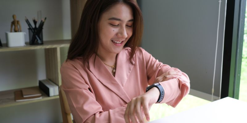 A woman looking at her watch