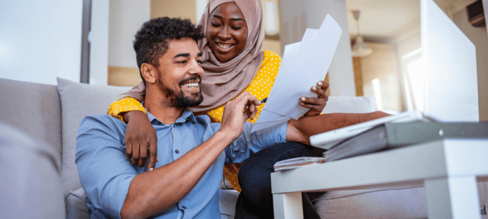 Beginner investor couple looking at documents