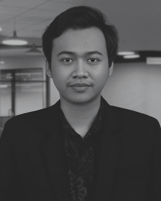 a woman sitting on a white chair next to a table