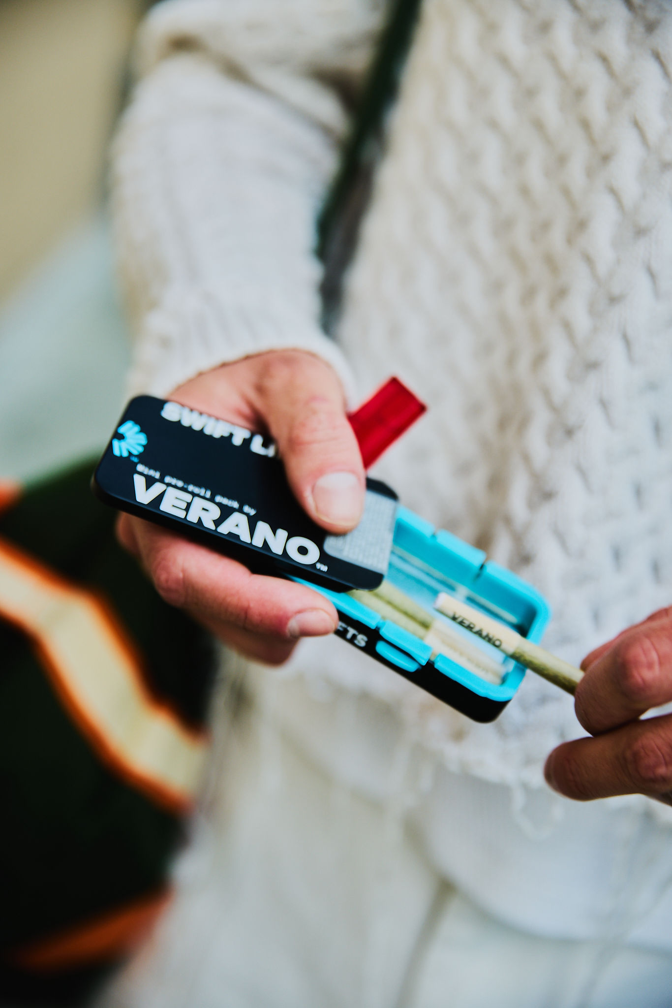 Woman with red hair covering mouth with hair