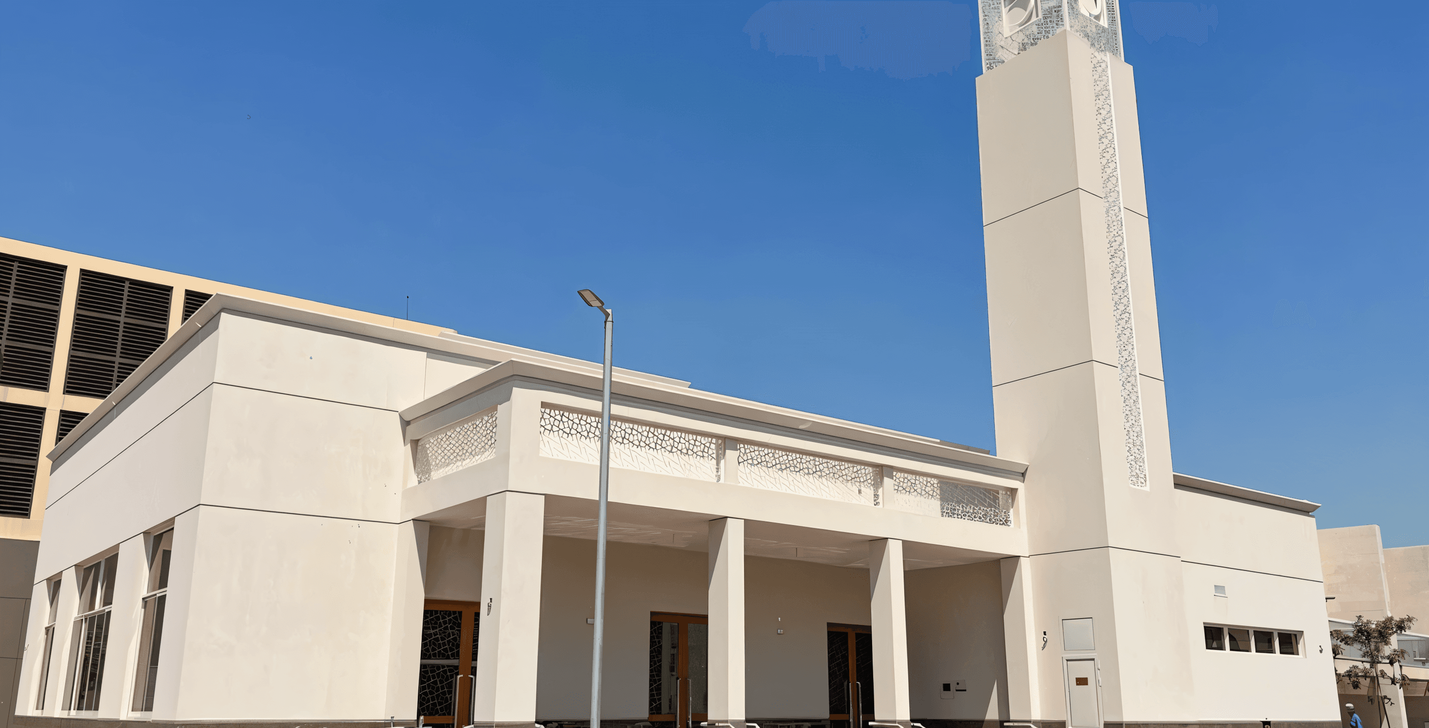 The building housing the apartment in International City, displaying a blend of modern architecture and outdoor space.