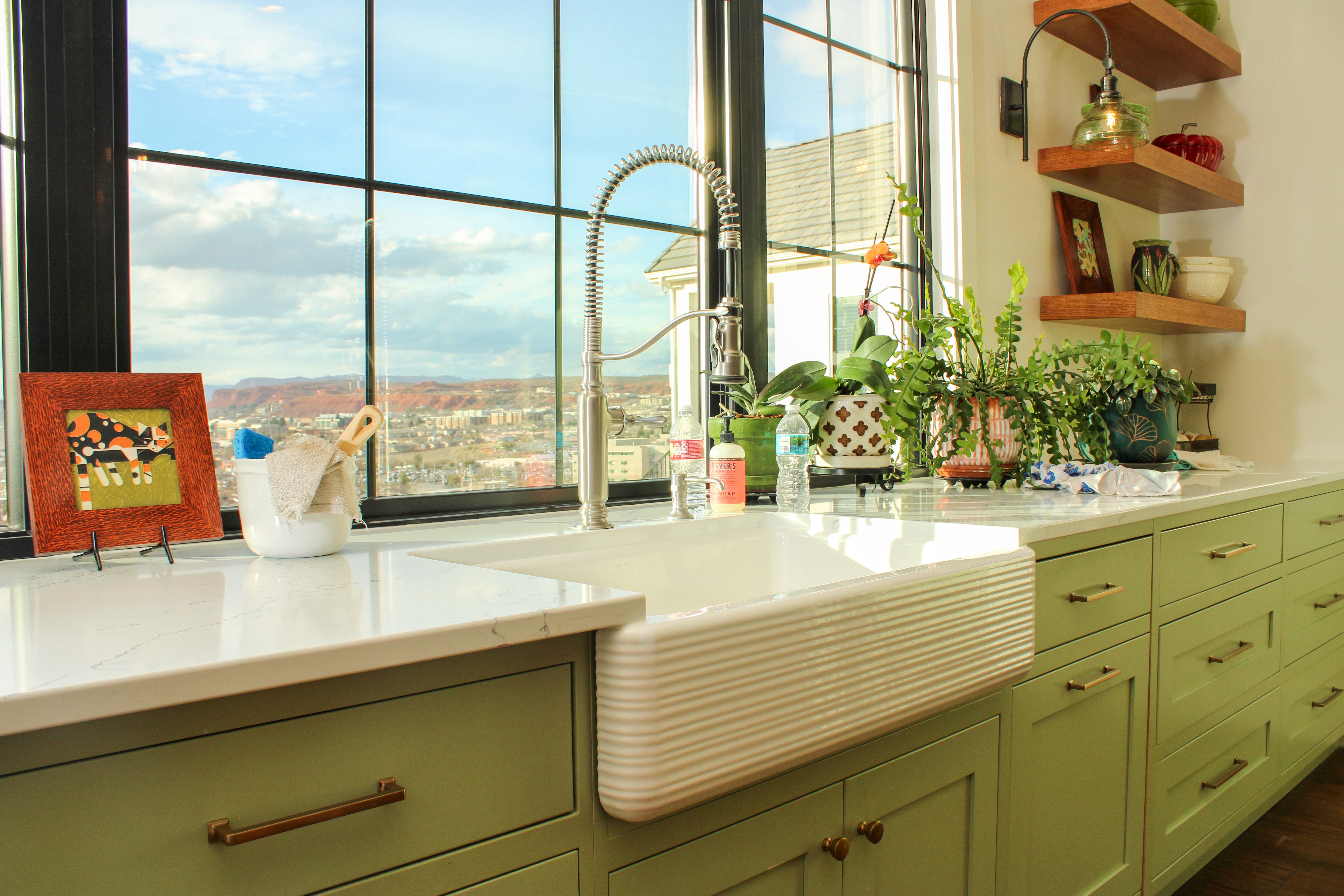 Southern Utah kitchen with sink positioned for valley views through expansive window in St. George
