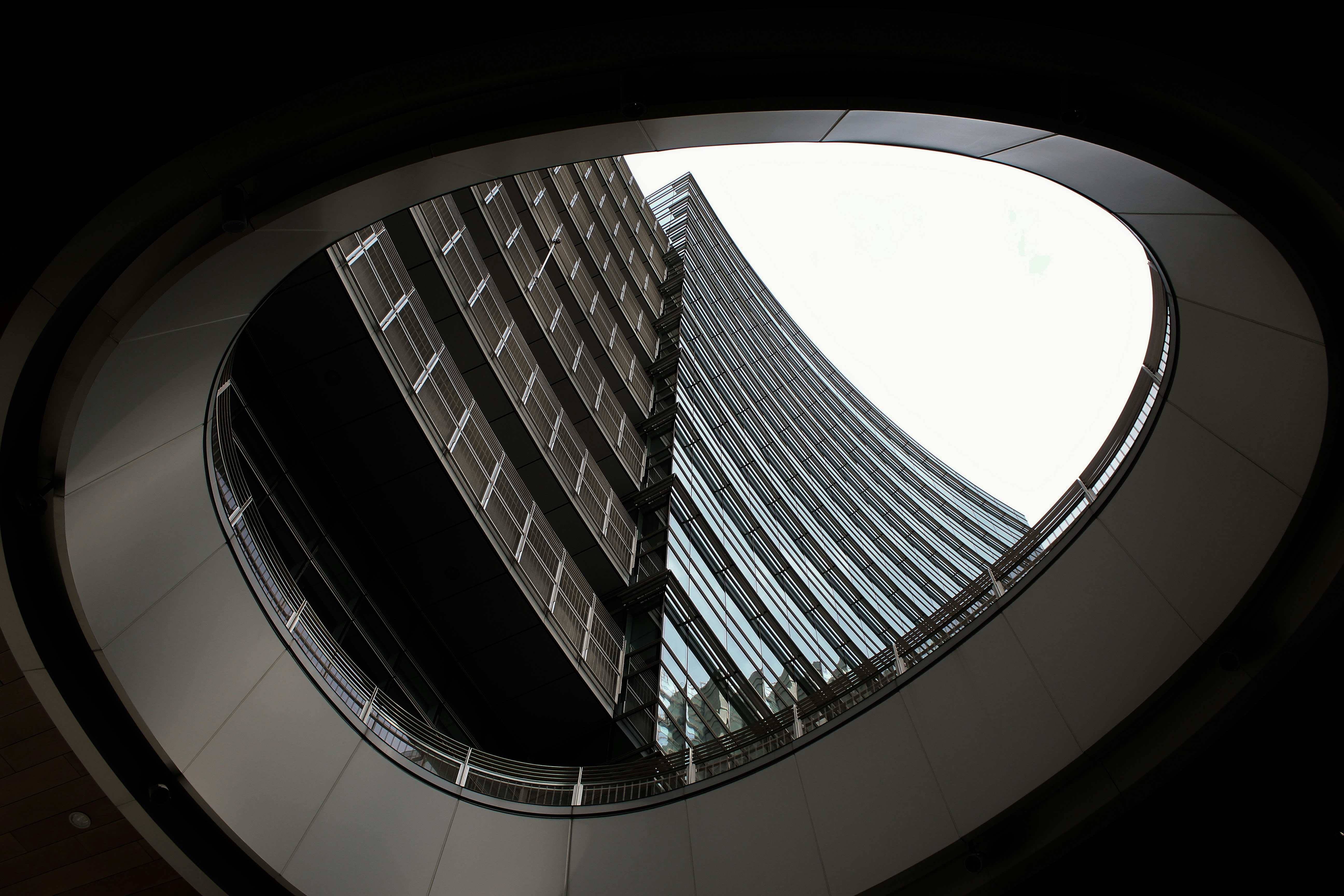 Modern architecture with curved balcony and glass building
