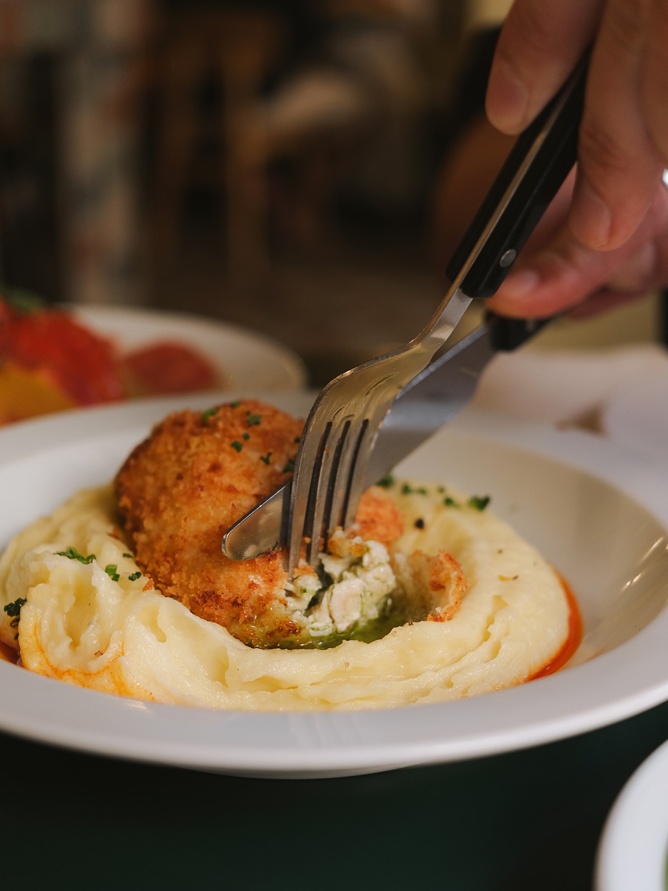 A plate of chicken and mashed potato