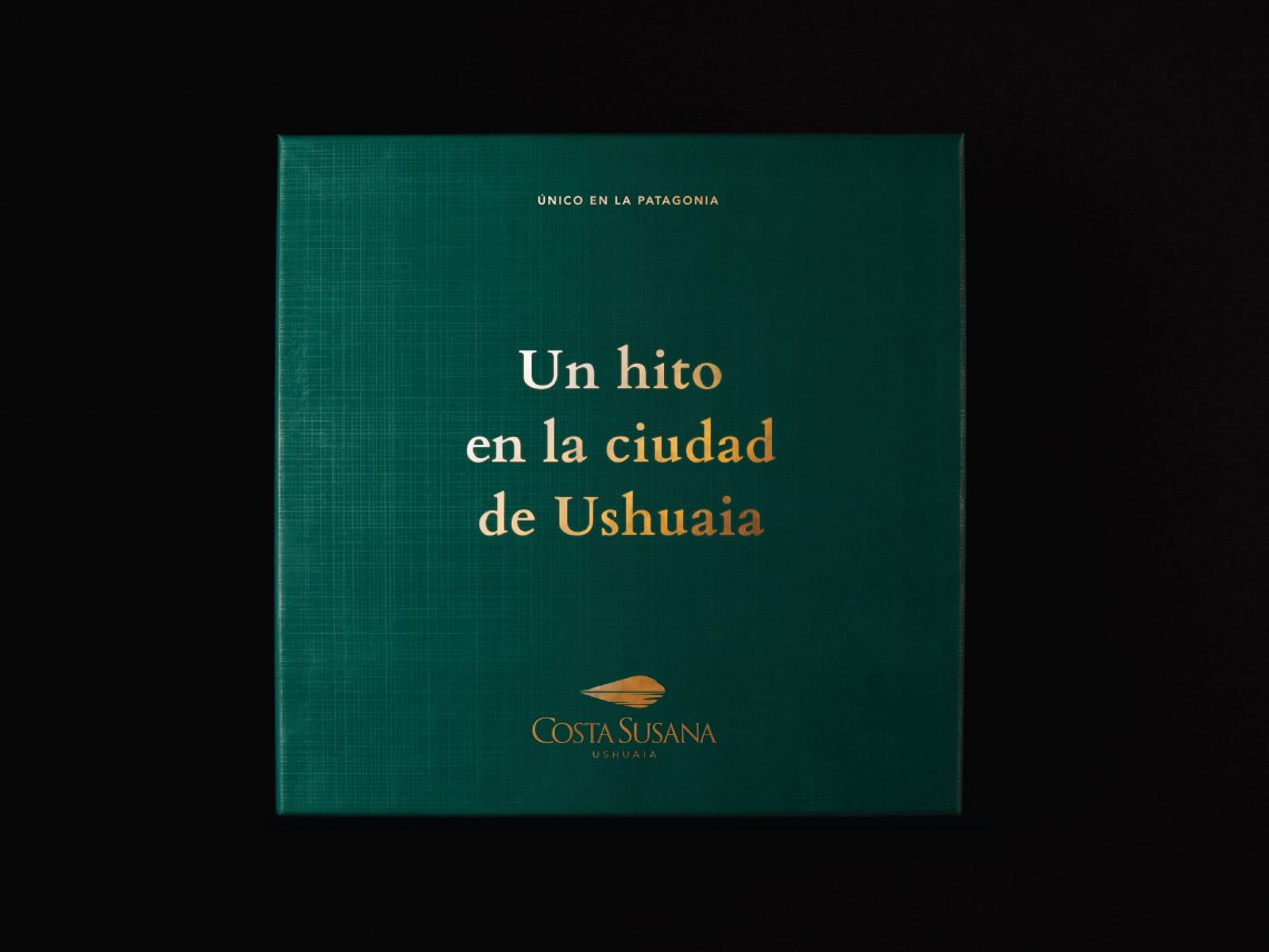 Rooftops of a coastal town with the sea in background