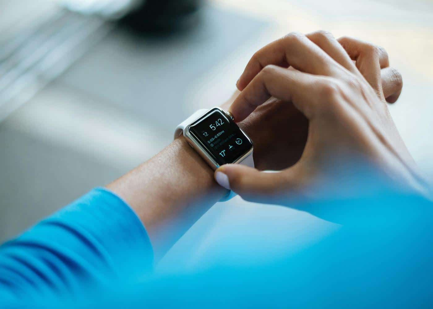 Woman monitoring heart health with a smart fitness tracker