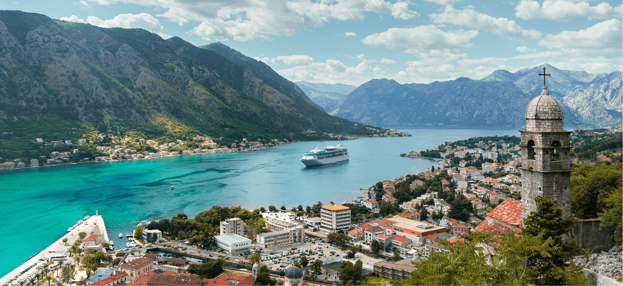 a river running through a lush green hillside
