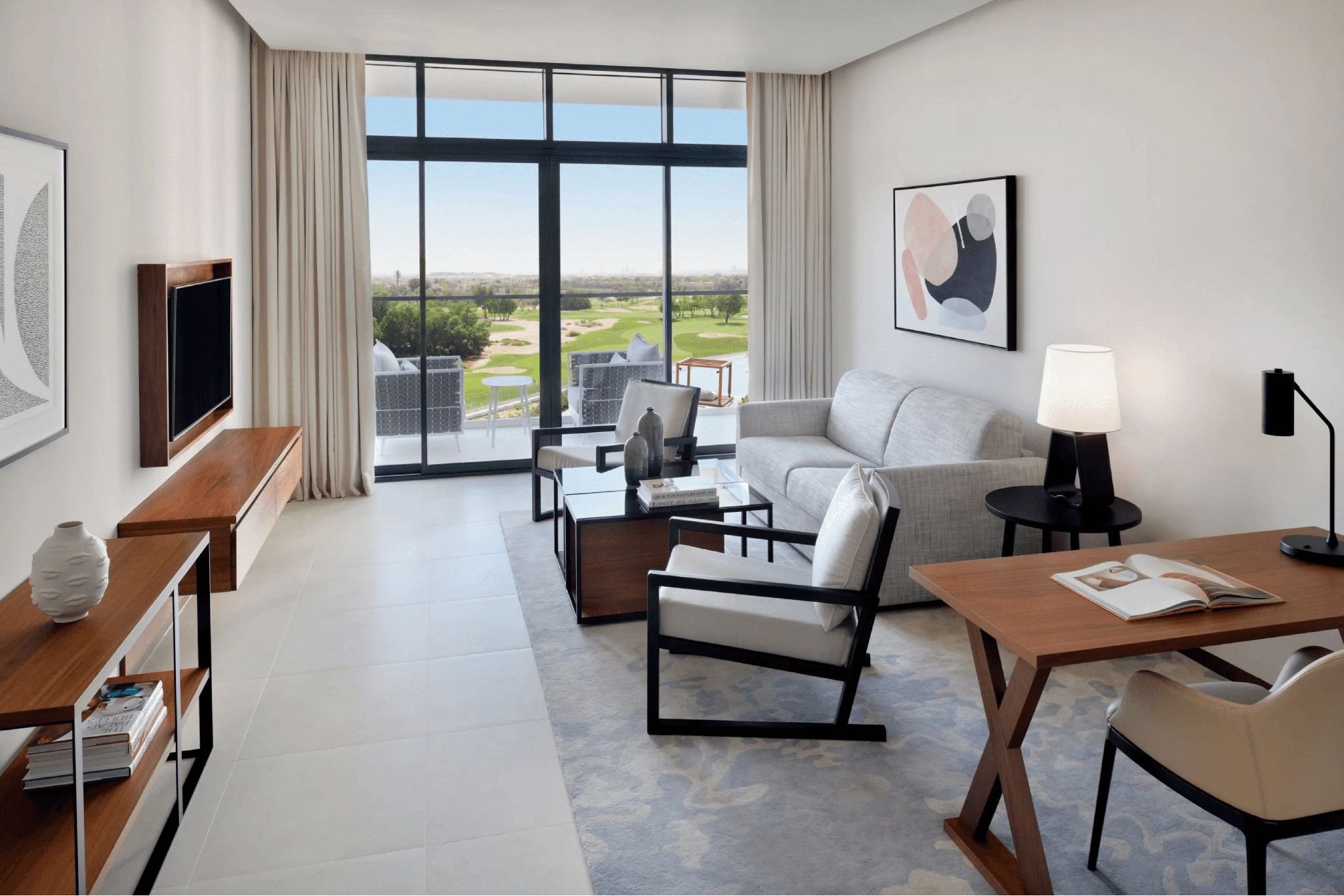 The Vida Emirates Hills, a pet-friendly hotel in Dubai that features a living room, a work desk, and access to the outdoor greens.