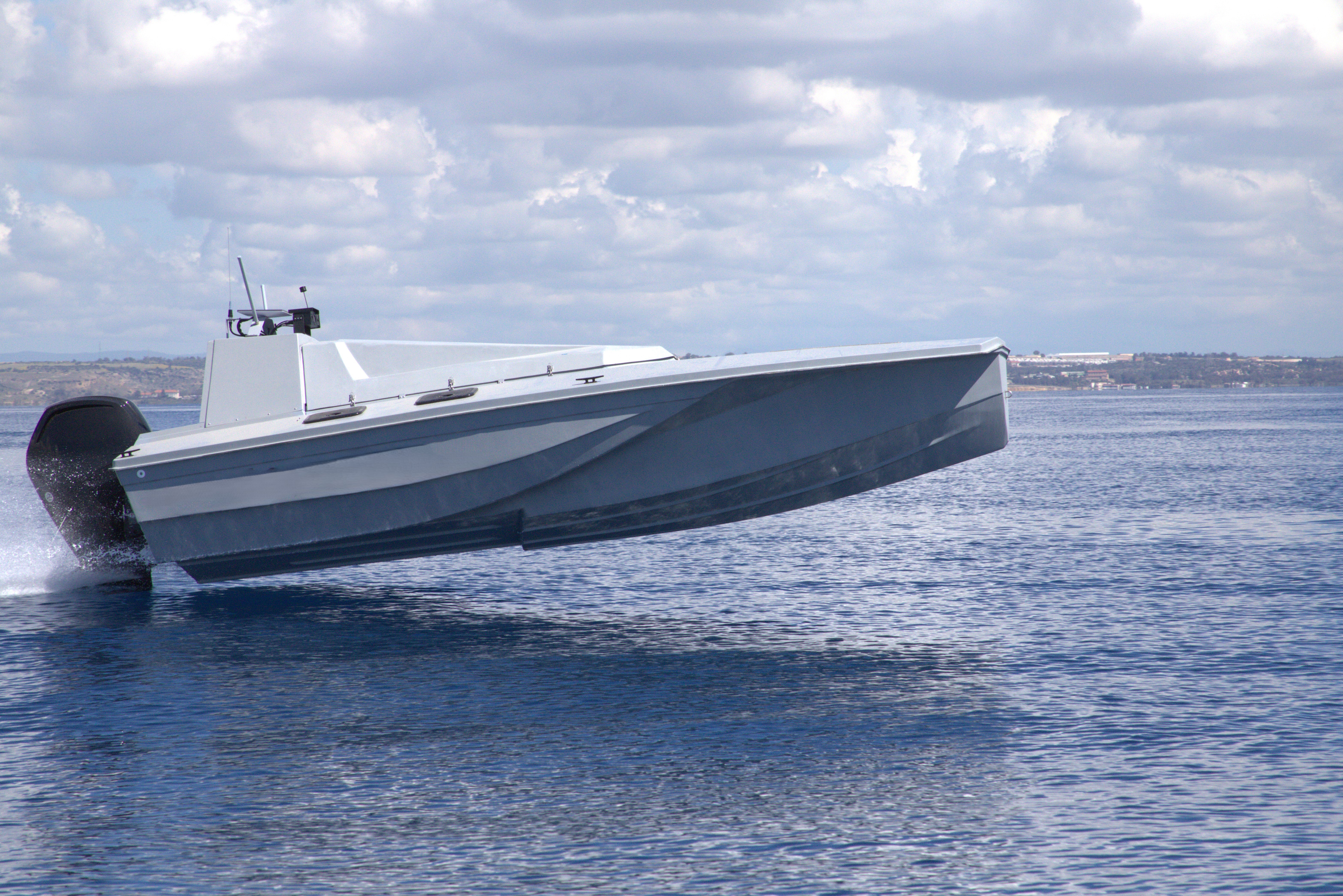 White luxury passenger boat on calm water