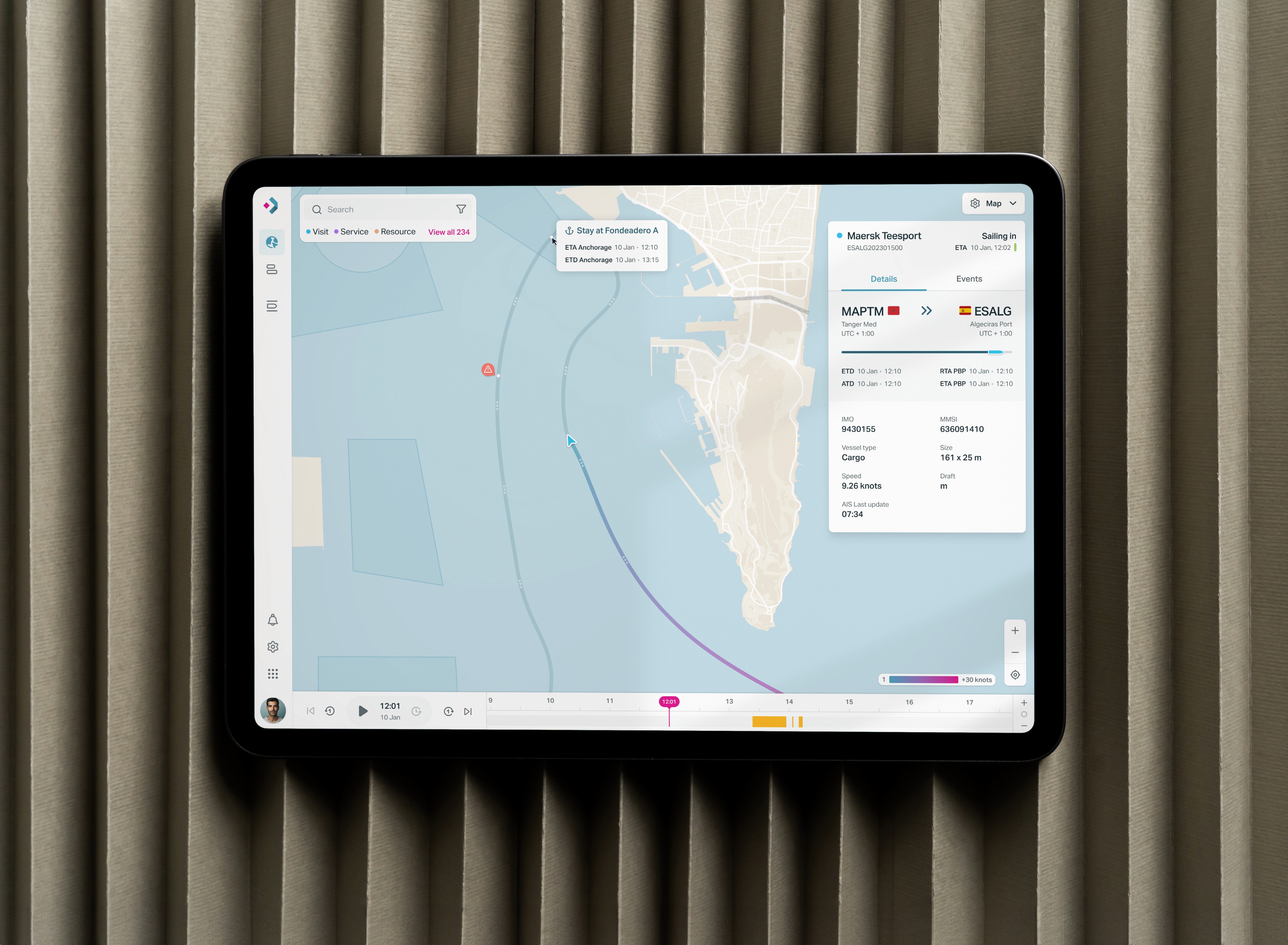 Tablet screen displaying a digital twin system of a port area, showing the trajectory of a ship.