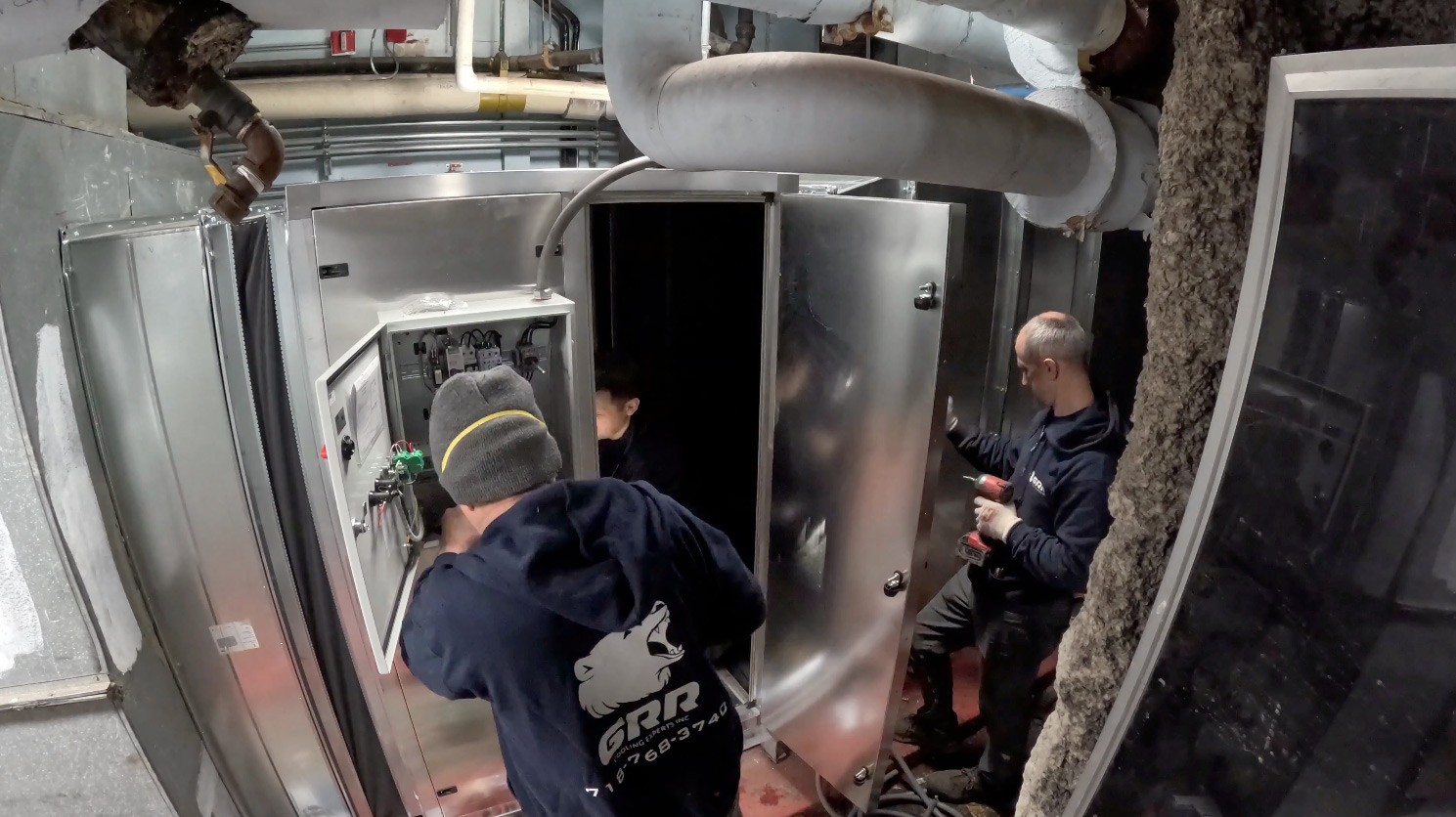 GRR Cooling Experts installing control panel and wiring during return fan retrofit at BronxCare hospital in NYC